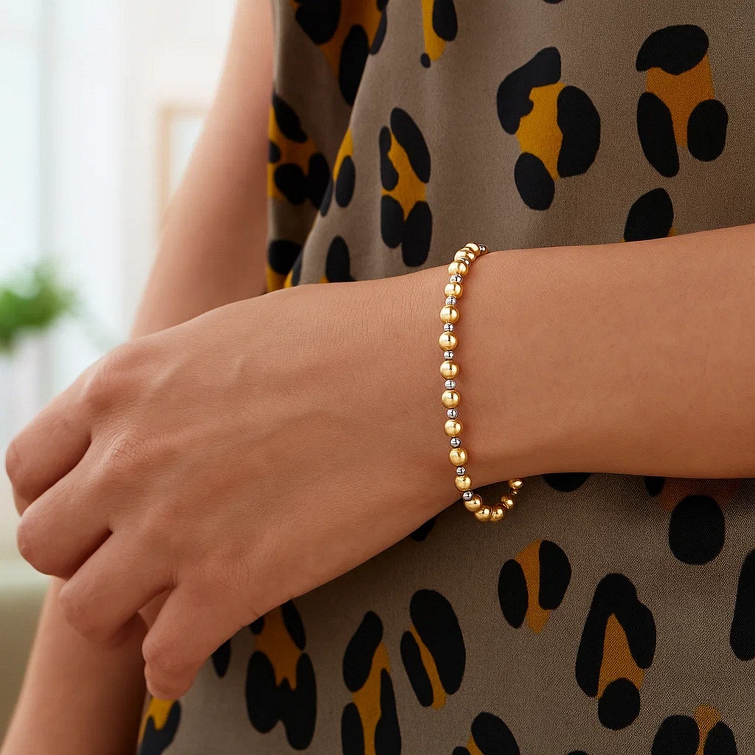 14k two-tone gold polished diamond cut bead bracelet featuring an elegant chain design, perfect for luxury styling.