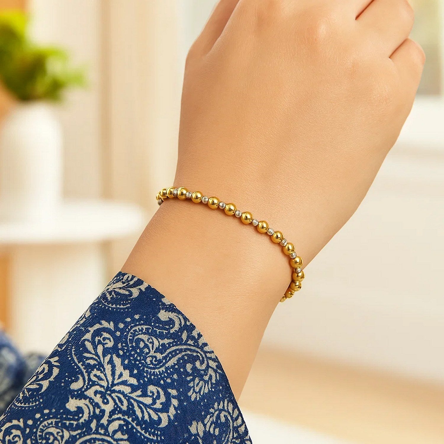 Elegant 14k two-tone gold polished diamond cut bead bracelet featuring a refined chain design, perfect for luxury styling.
