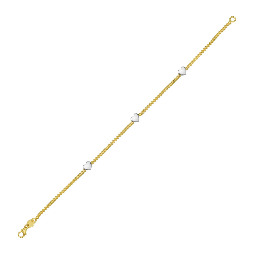 14K yellow and white gold heart bead bracelet adorned with sparkling diamonds for an elegant luxury touch.