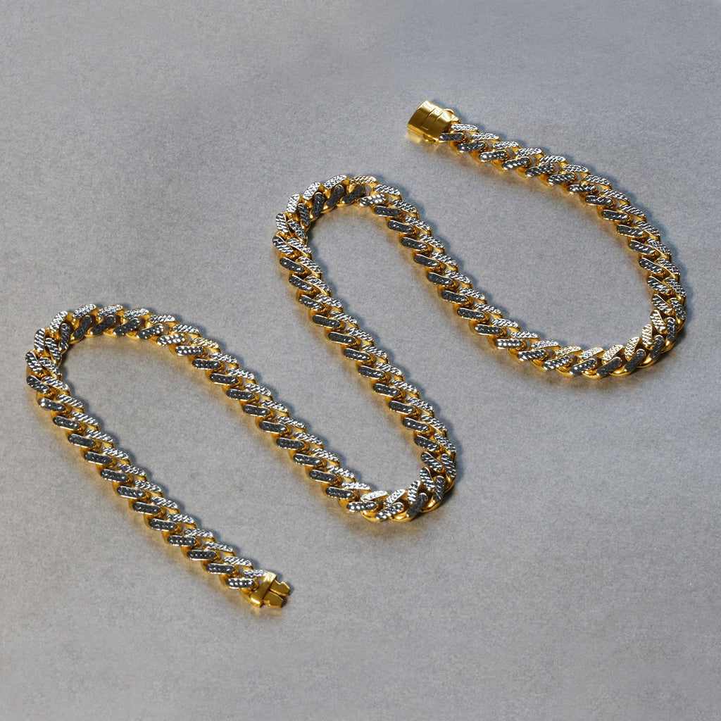 14k two-tone gold Miami Cuban chain necklace featuring white pave diamonds in a modern design.