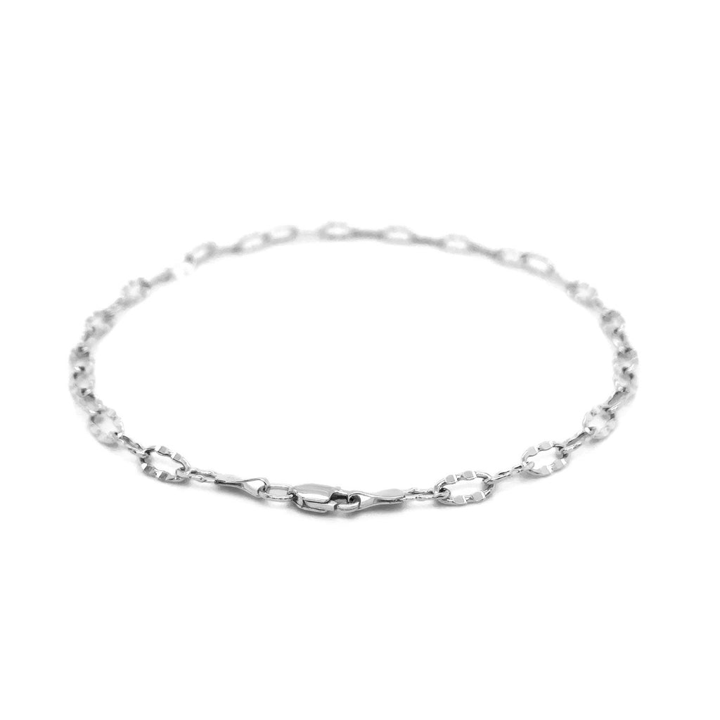 Elegant 14k white gold anklet featuring fancy hammered oval links for a refined, luxurious touch.