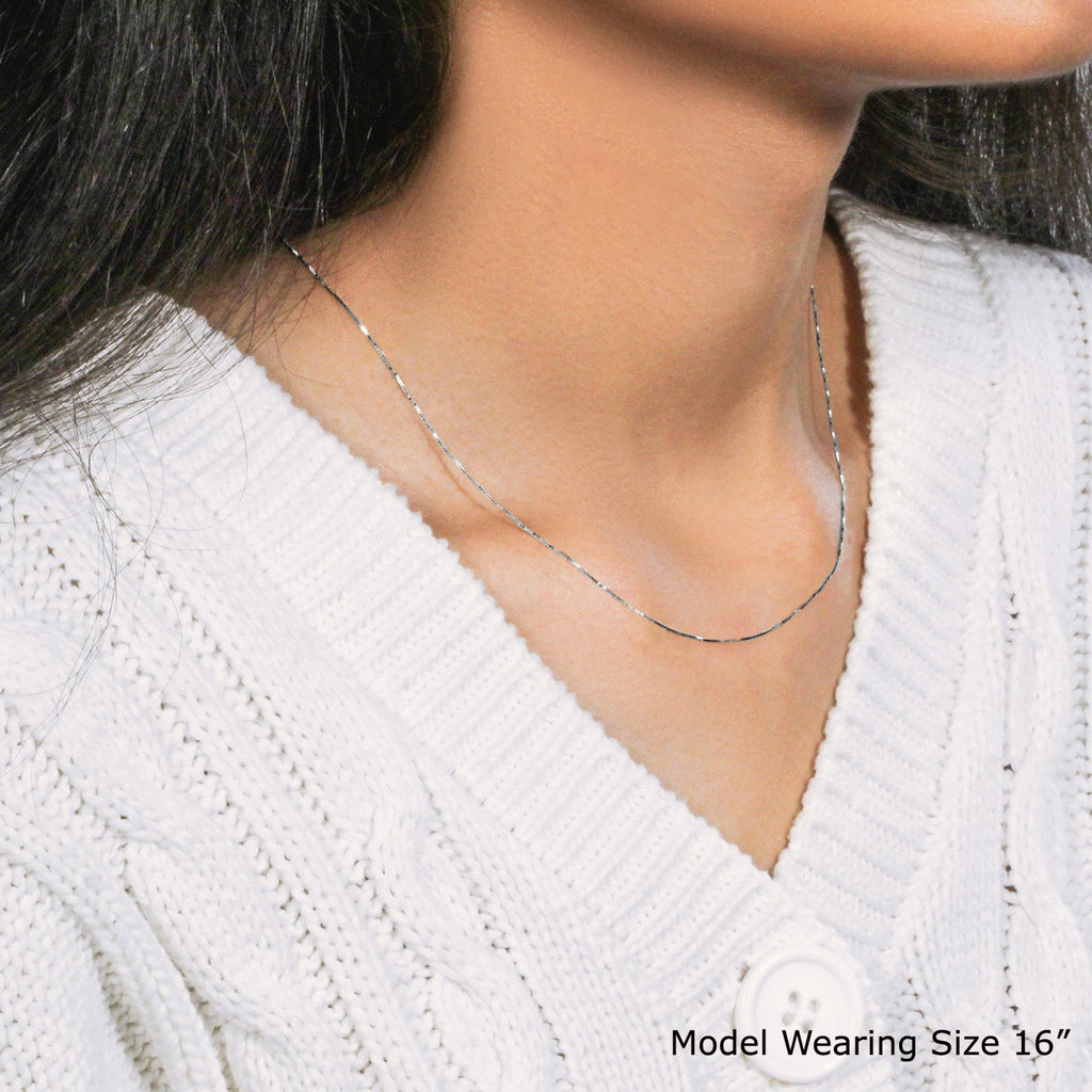 14k white gold classic box chain, 0.45 mm, featuring a sleek design perfect for layering or wearing solo.