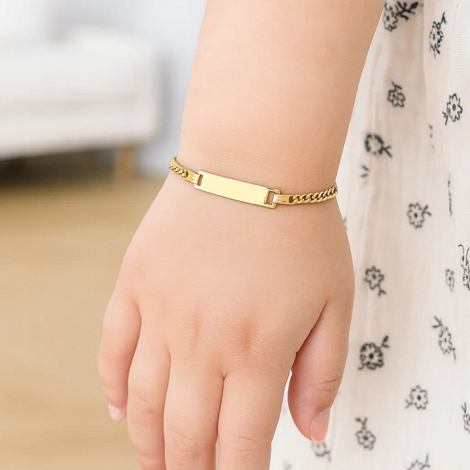 14k yellow gold curb link children's ID bracelet with modern design and secure chain for timeless elegance.
