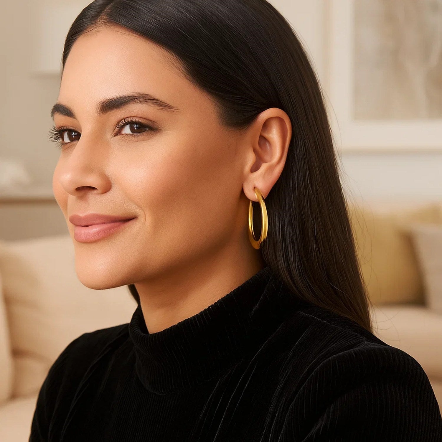 14K yellow gold oval electroform hoop earrings, showcasing a classic design with elegant curves and a luxurious finish.