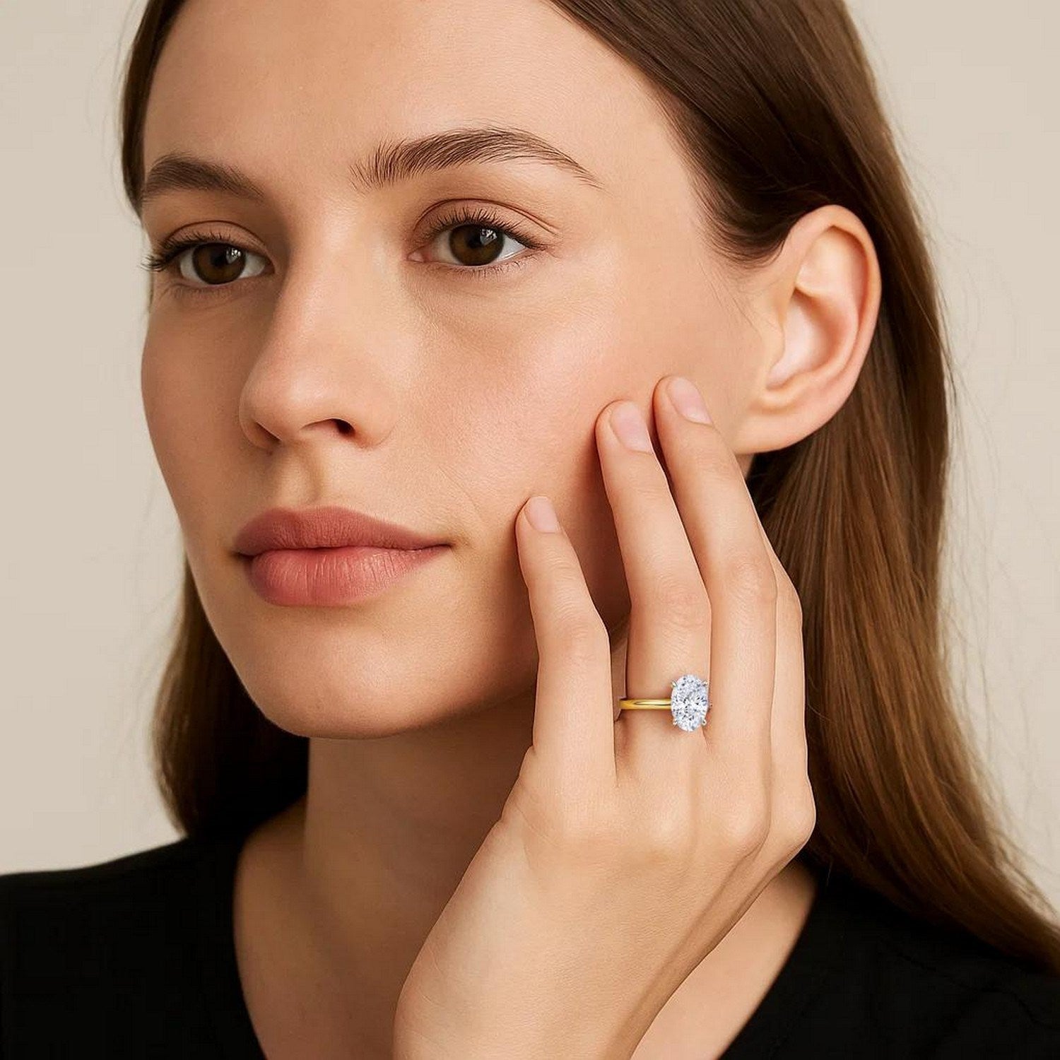 Elegant 2 carat oval lab-grown diamond solitaire ring in 14k yellow gold, showcasing timeless luxury and sophistication.