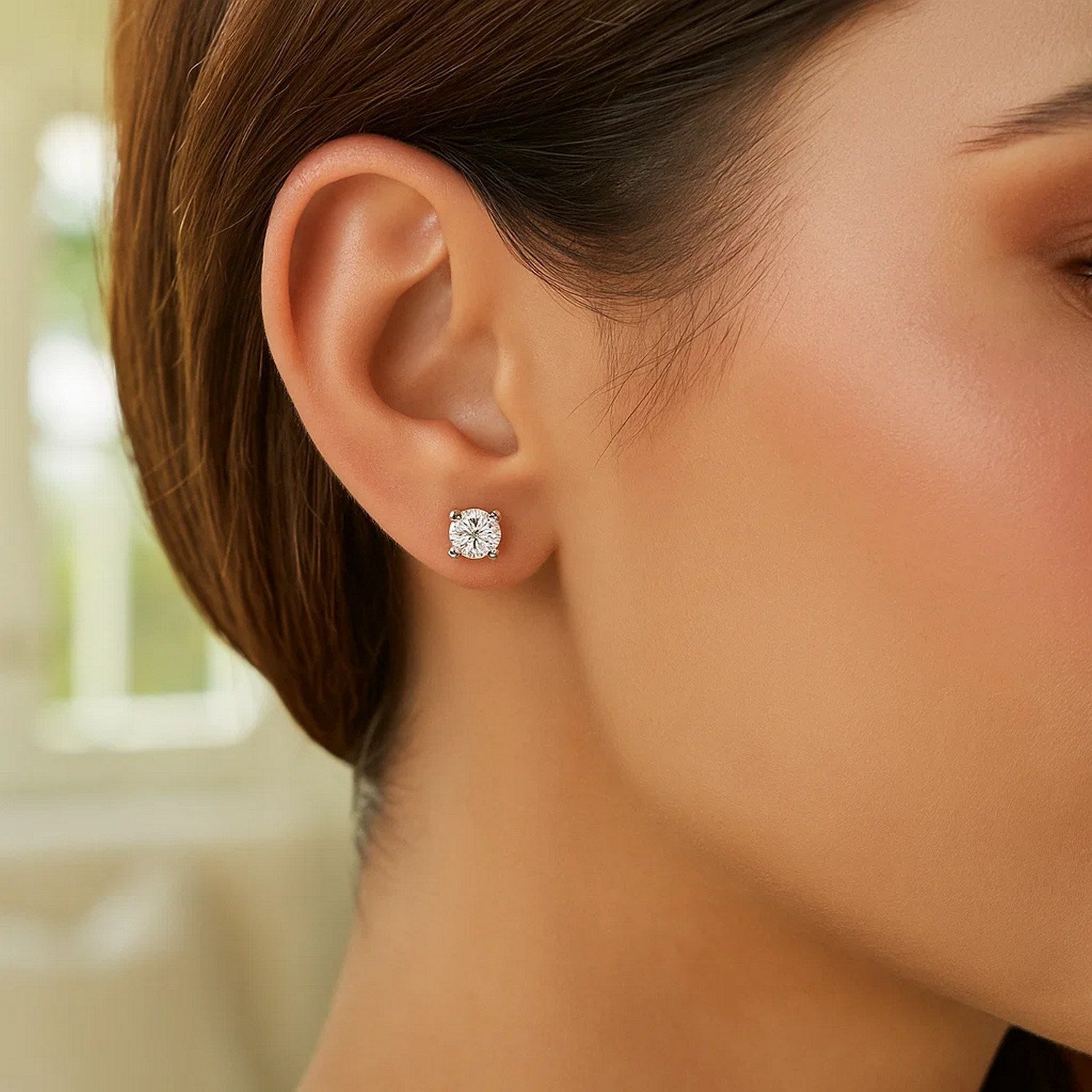 Sterling Silver Polished Faceted Stud Earrings with White Hue Cubic Zirconia