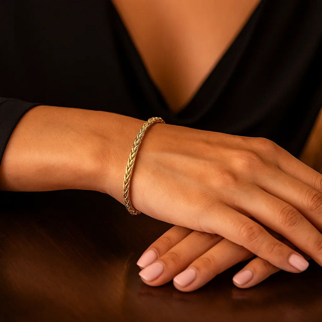 Elegant 14k yellow gold lightweight wheat bracelet featuring a refined chain design, perfect for sophisticated styling.