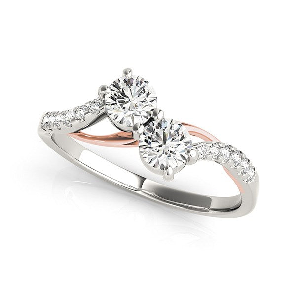 Two stone diamond ring in 14k white and rose gold with a modern curved band design, showcasing exquisite craftsmanship.