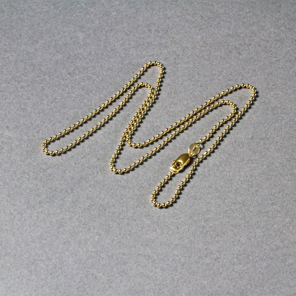 14k yellow gold minimalist bead chain, 1.5mm, featuring exquisite diamond accents for a refined elegance.