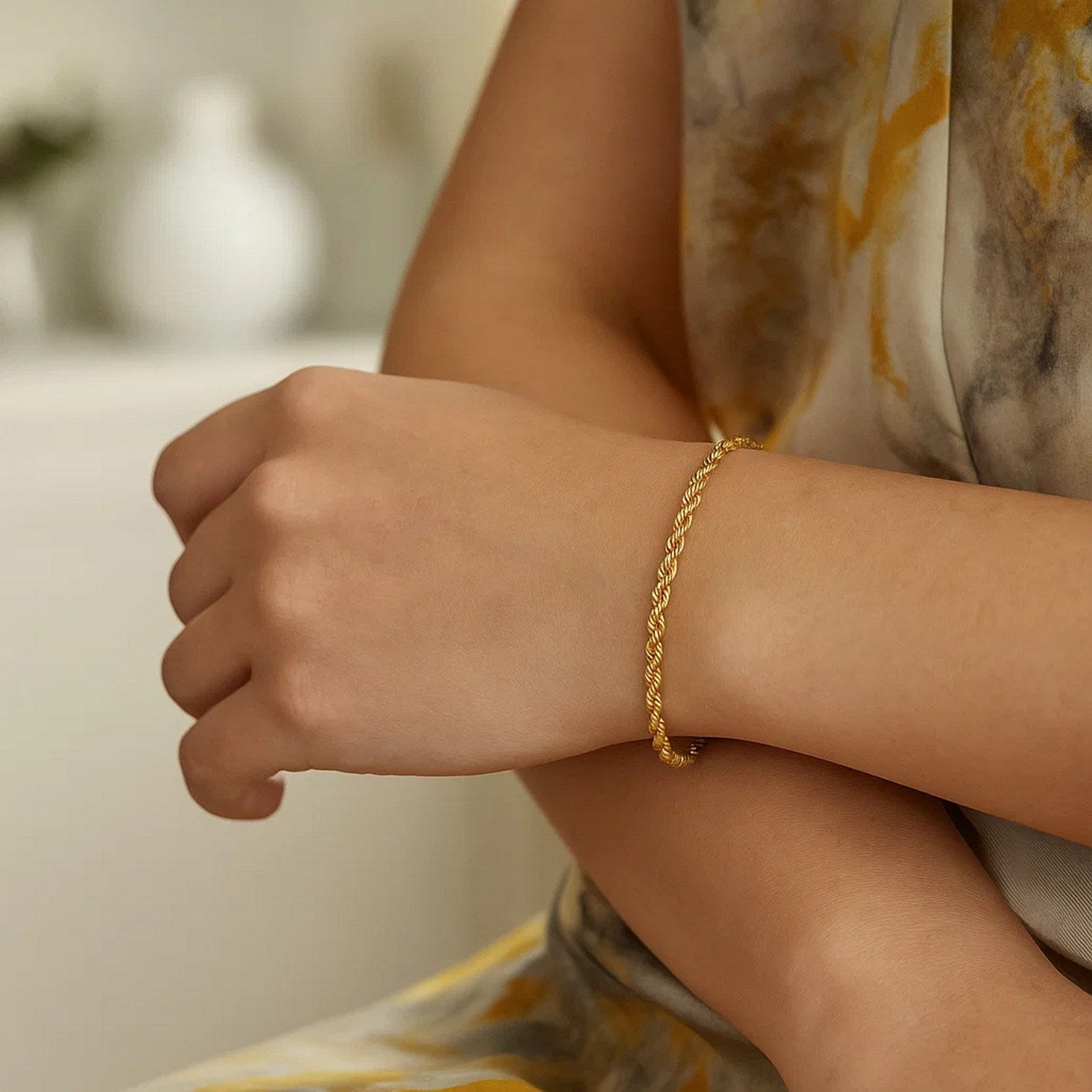 Silk rope chain bracelet in 14k yellow gold, featuring a classic design with elegant, smooth links.