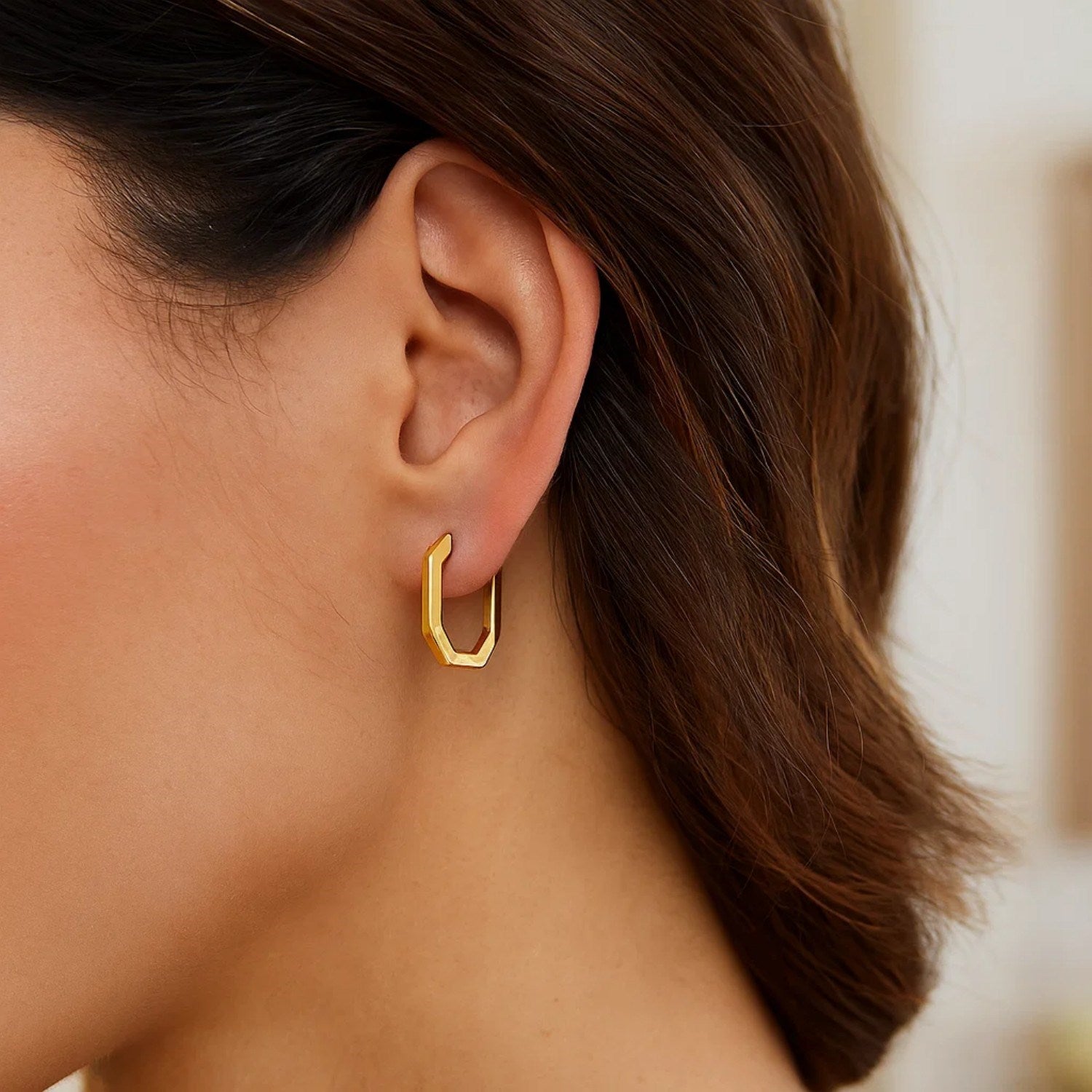 14k yellow gold polished hoop earrings with a sleek modern design, perfect for elegant everyday wear.