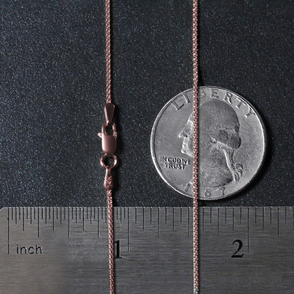 Elegant 14k rose gold round wheat chain, 1.00 mm, showcasing a refined and timeless design for luxury jewelry lovers.