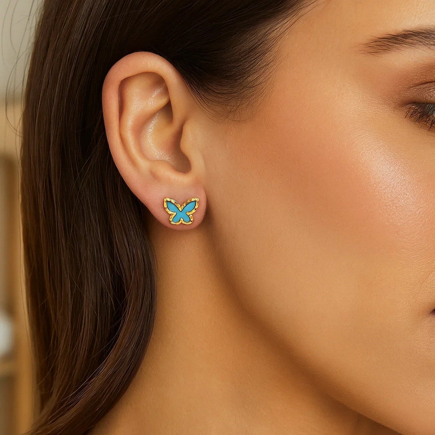 14k yellow gold contemporary butterfly stud earrings featuring vibrant turquoise accents and sleek design.