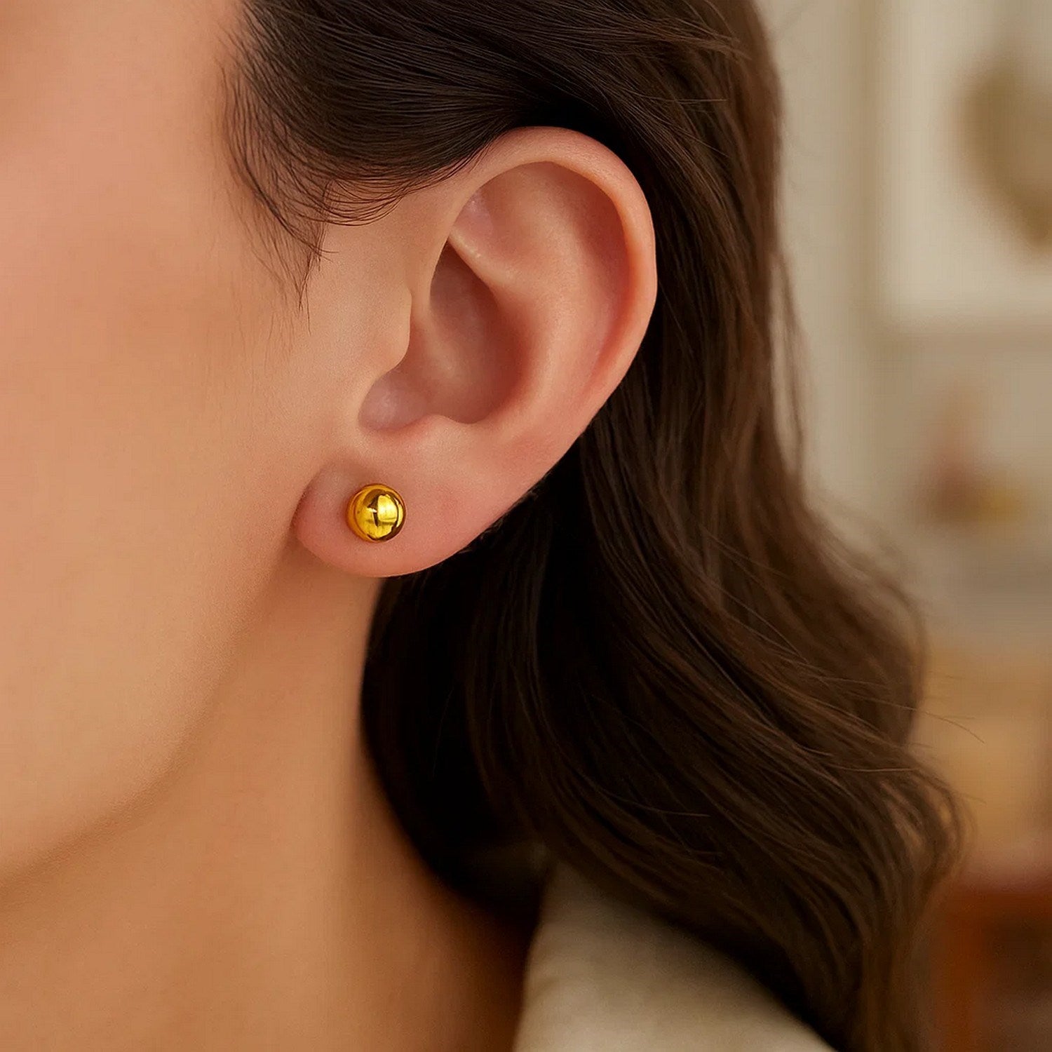 14k yellow gold polished round motif stud earrings, showcasing a modern design with a luxurious shine.
