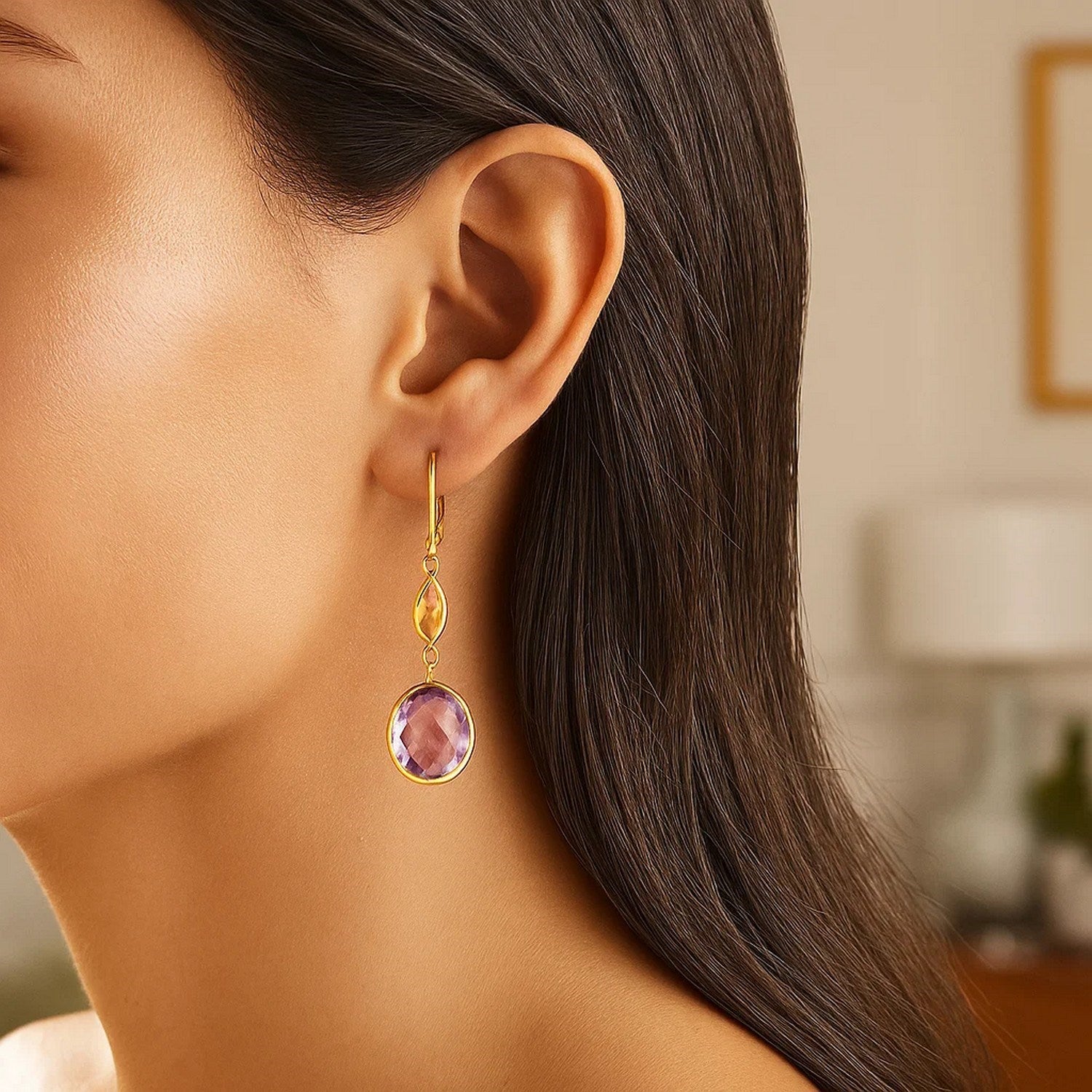 Elegant 14k yellow gold drop earrings featuring vibrant citrine and amethyst briolettes, showcasing exquisite craftsmanship.