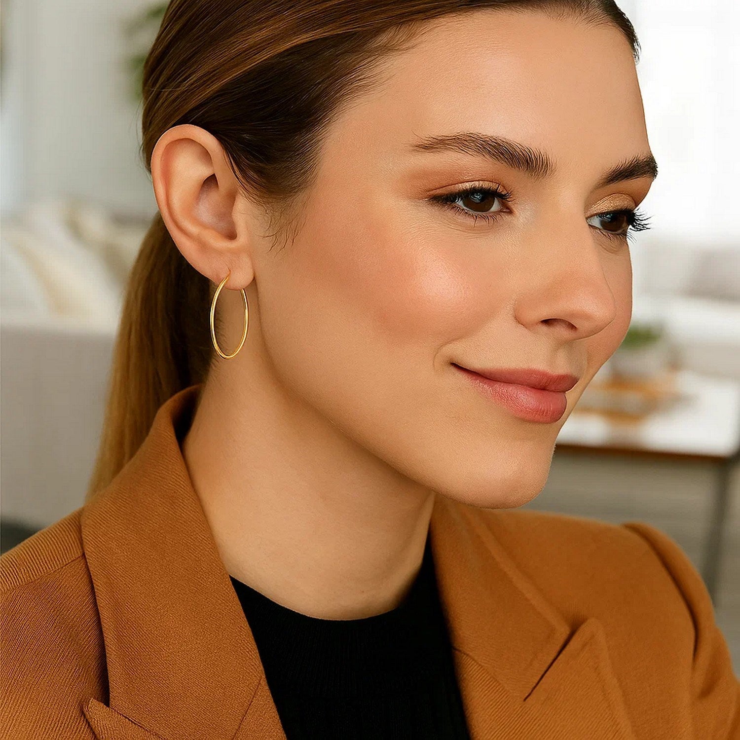 Elegant 14k yellow gold polished hoop earrings showcasing a timeless design for sophisticated style.