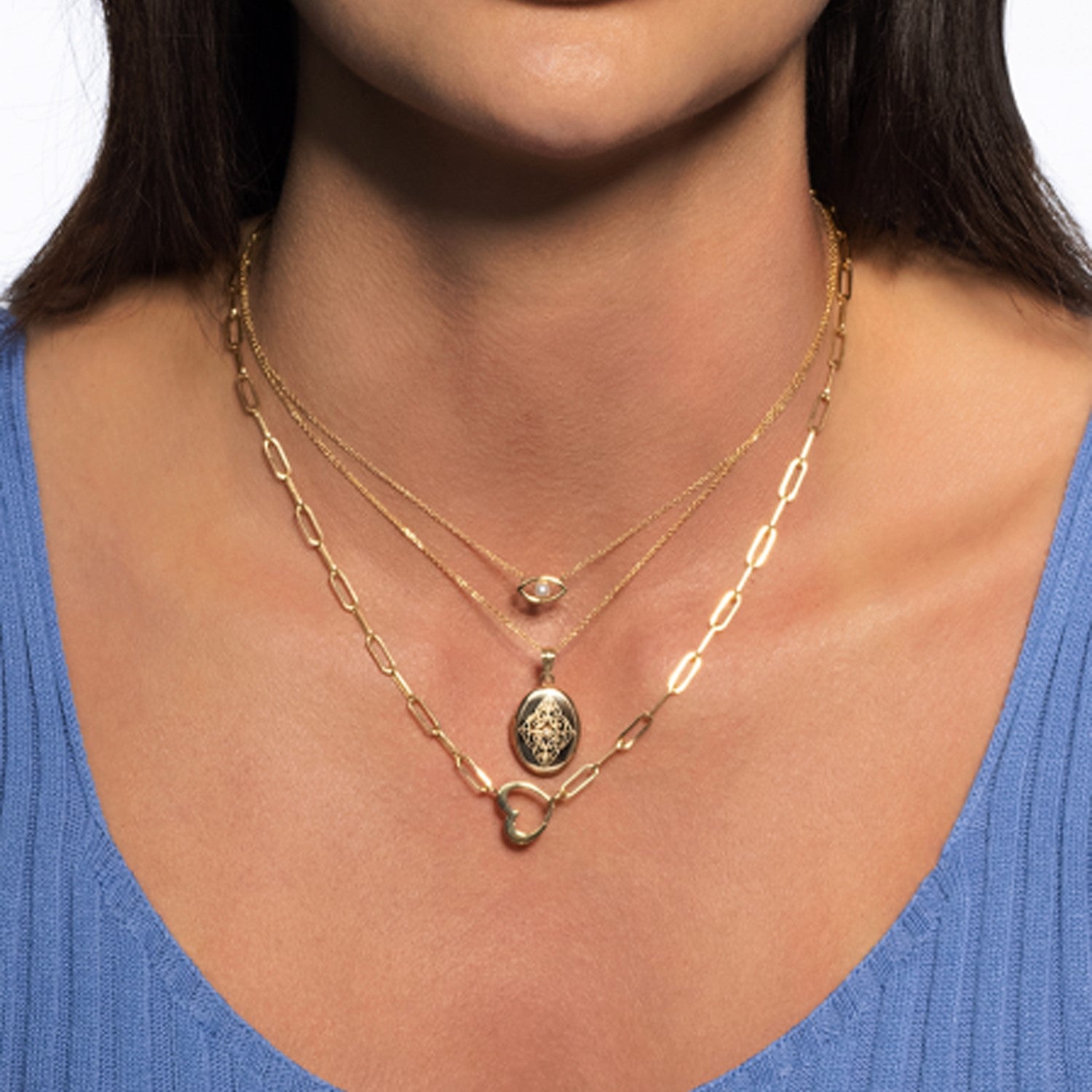 14k yellow gold heart element paperclip necklace with modern design and elegant chain detail.
