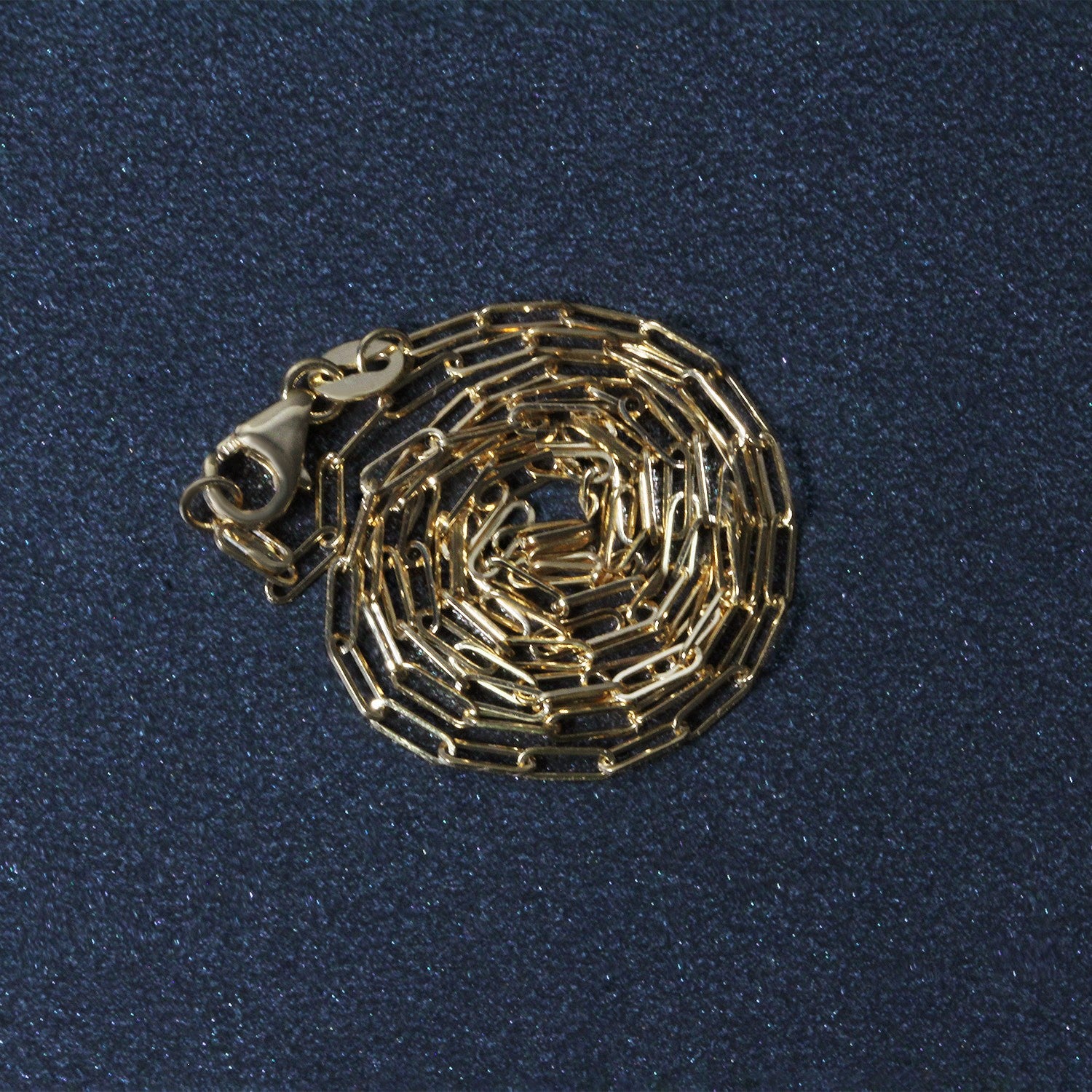18K yellow gold fine paperclip chain, modern design with elegant round links, perfect for layering or standalone wear.