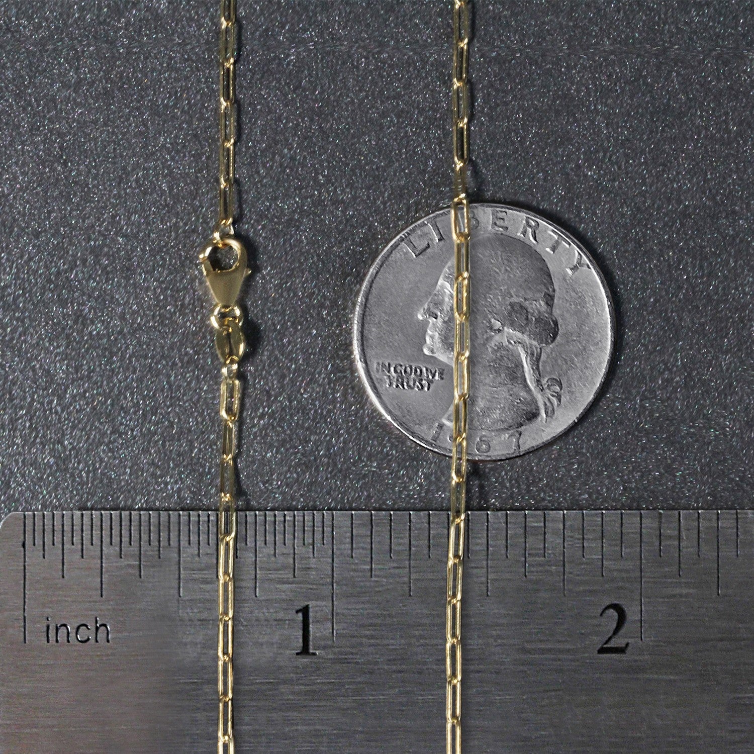 18K yellow gold fine paperclip chain with a modern design, featuring sleek round links for a sophisticated look.