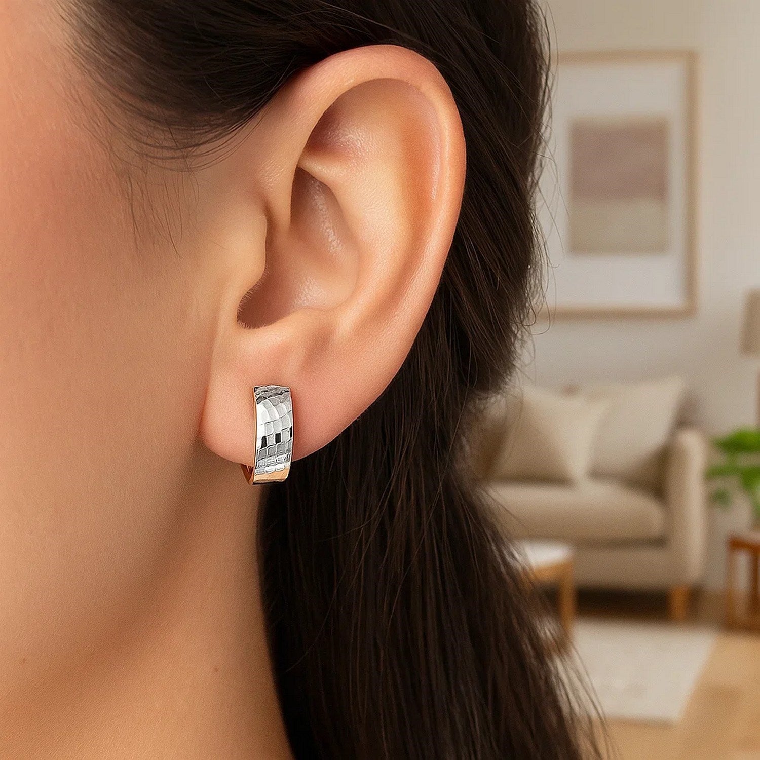 Elegant 14k two-tone gold textured hoop earrings adorned with sparkling diamonds, perfect for any luxurious occasion.