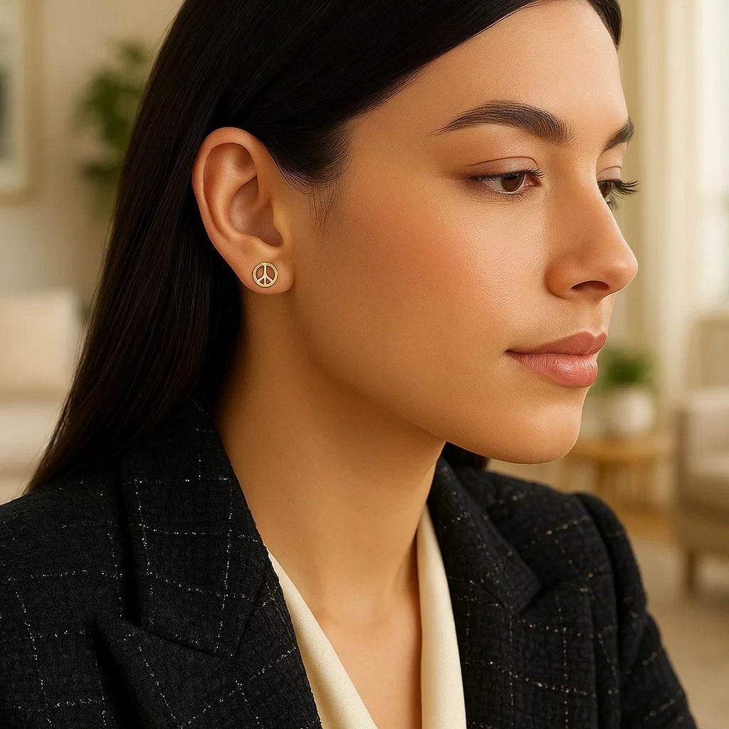 Elegant 14k yellow gold peace sign post earrings showcasing a luxurious and timeless design.