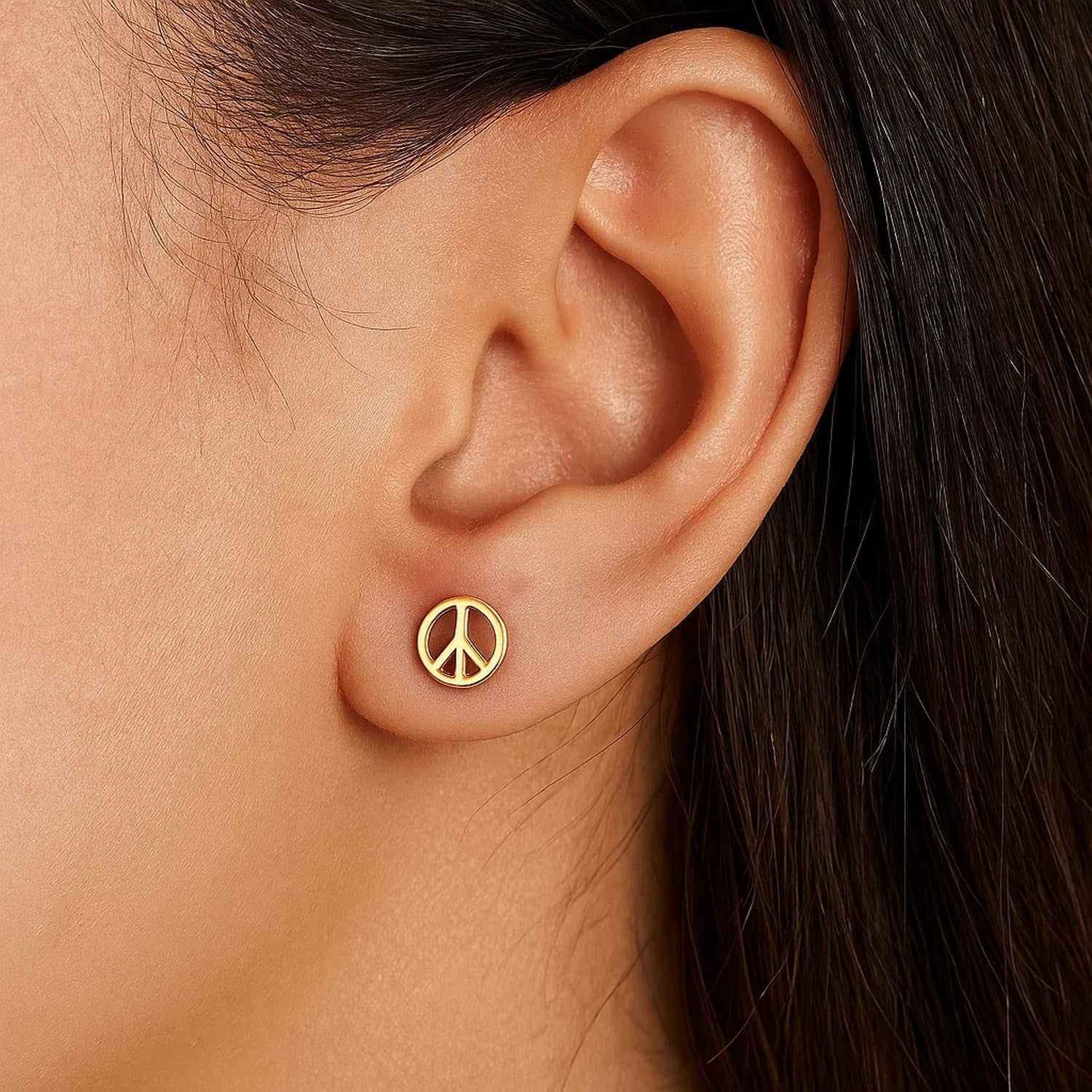 Elegant 14k yellow gold peace sign post earrings, showcasing a luxurious and timeless design for refined style.