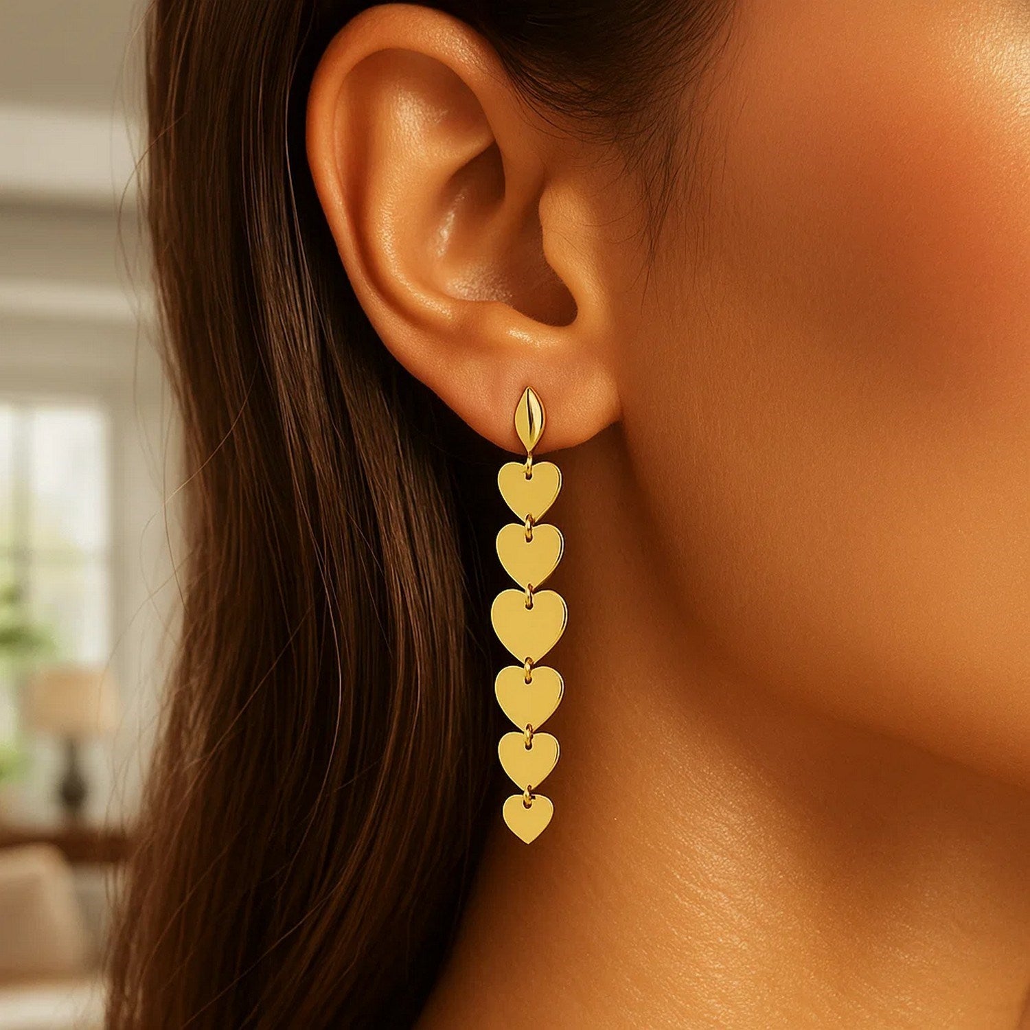 Elegant 14k yellow gold heart drop earrings showcasing a refined design and timeless allure for luxury jewelry lovers.