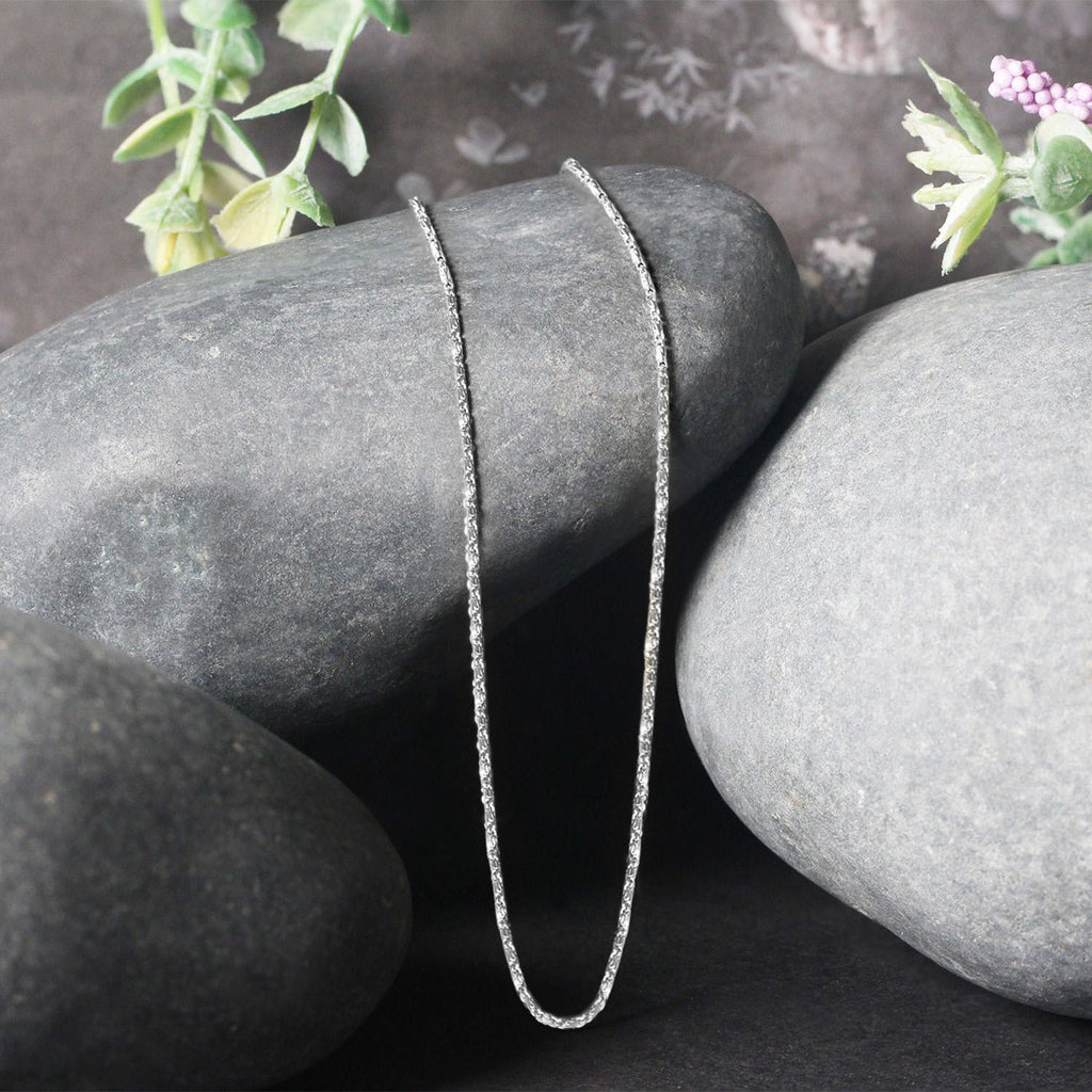 Elegant 14k white gold Lumina pendant chain showcasing a refined design and delicate 0.90 mm link detail.