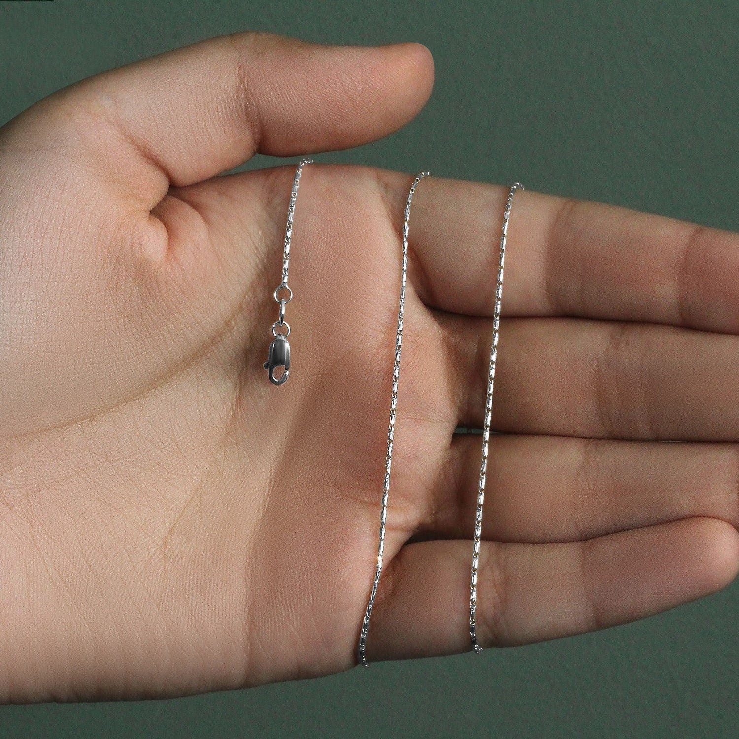 Elegant 14k white gold Lumina pendant chain featuring a sleek design, perfect for layering or standalone wear.