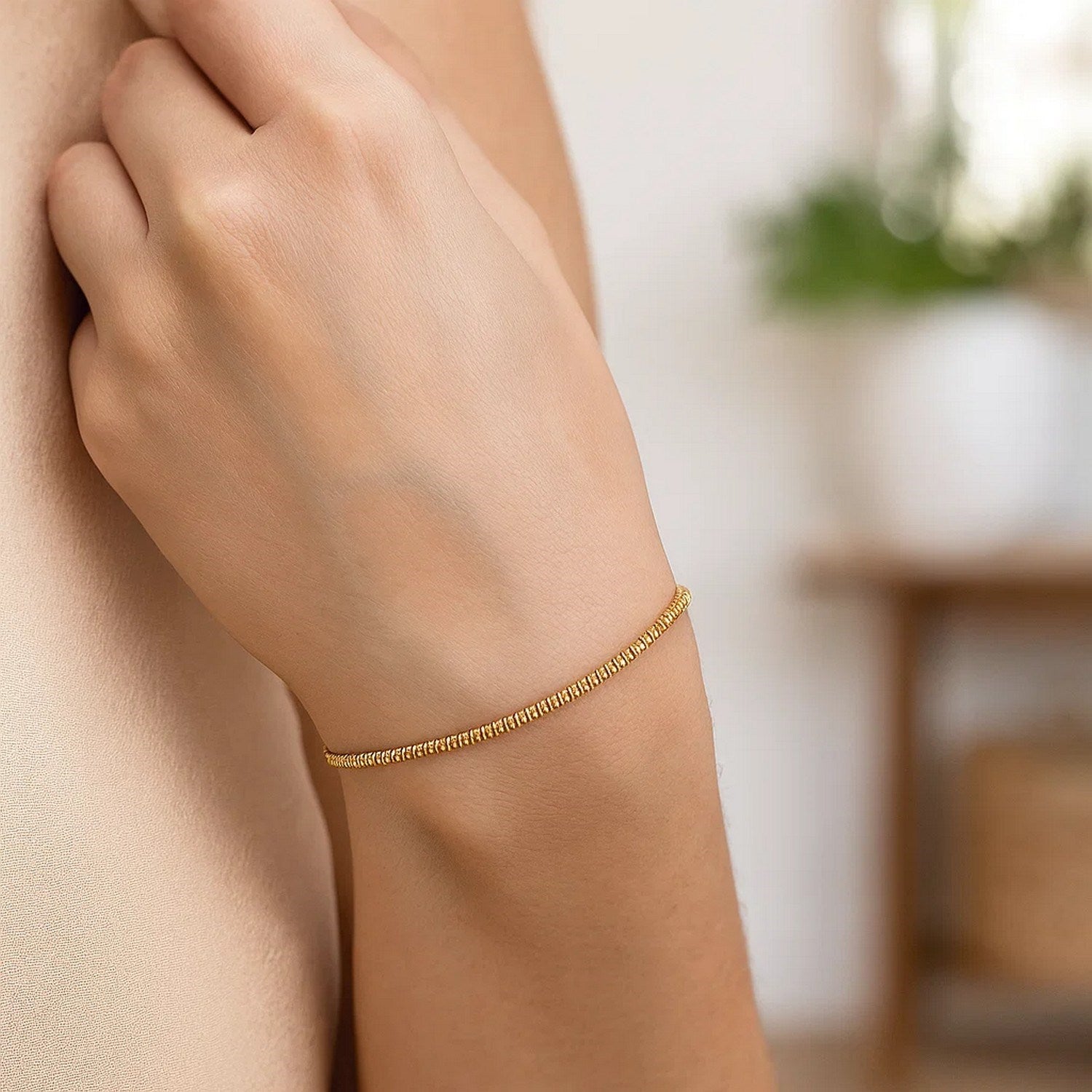 14k yellow gold modern chain bracelet featuring a delicate sparkle design, perfect for elegant layering.