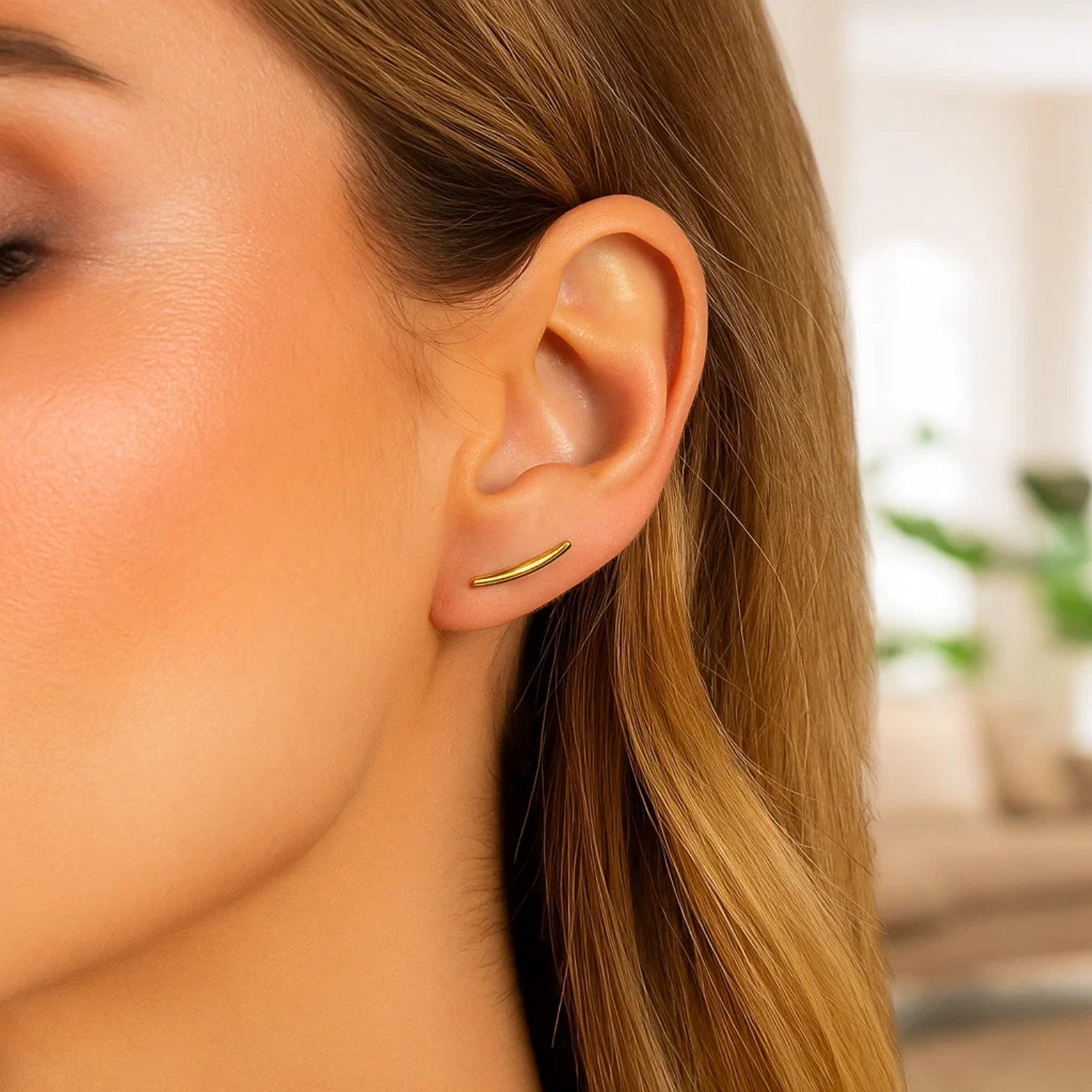 14k yellow gold polished curve climber earrings, elegantly designed for a luxurious and sophisticated look.