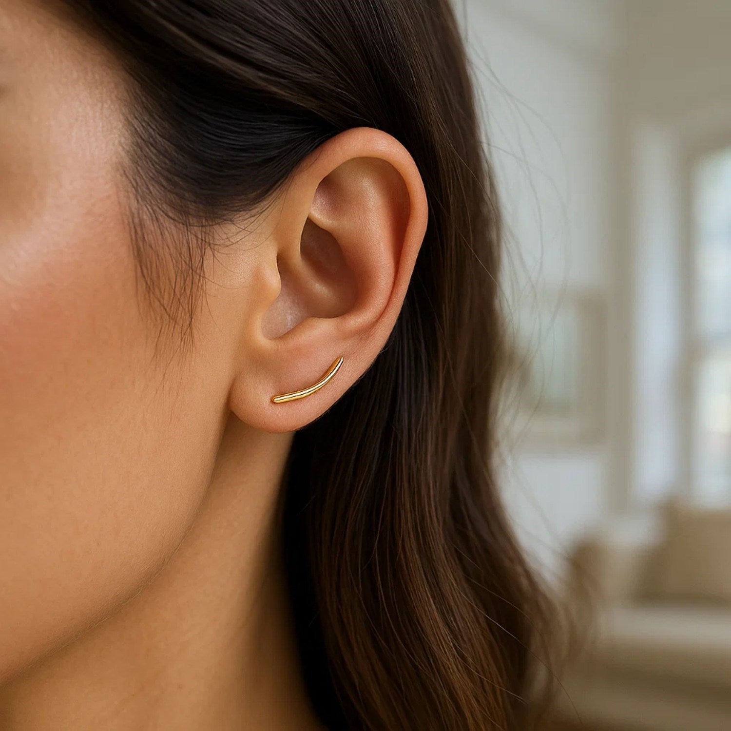14k yellow gold polished curve climber earrings, elegantly designed for a luxurious and modern look.