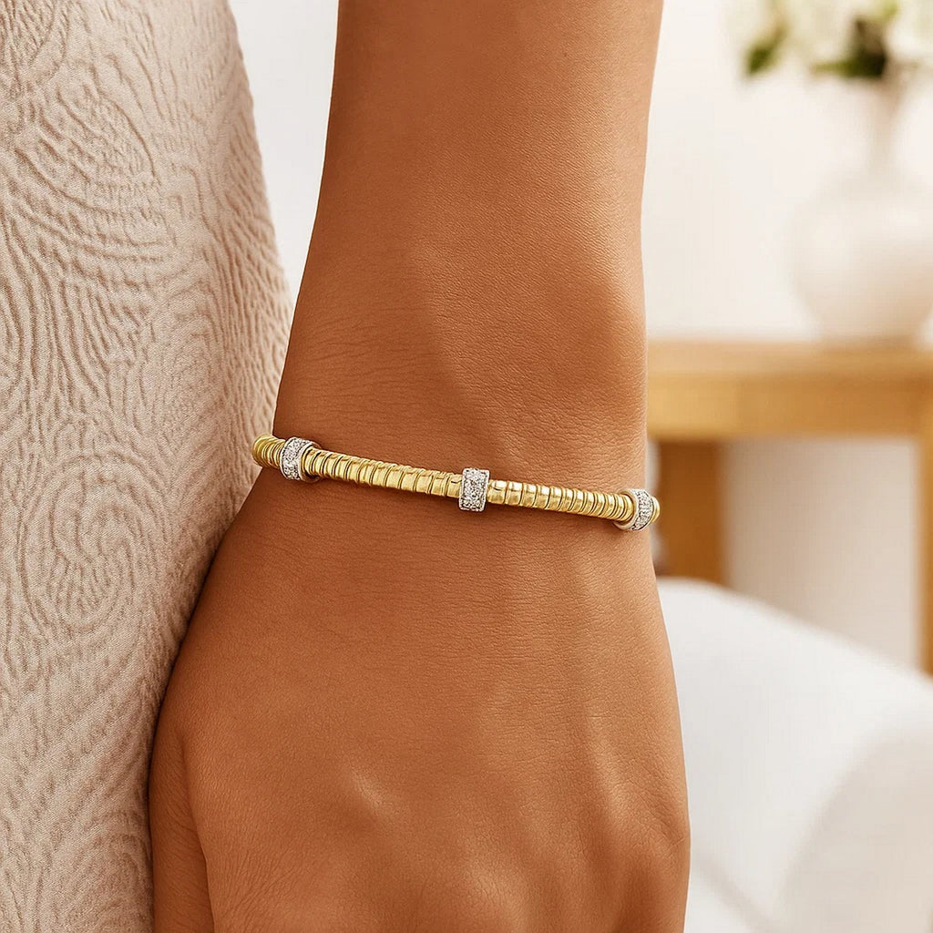 14K yellow gold diamond triple station tubogas bracelet showcasing modern elegance and luxurious craftsmanship.