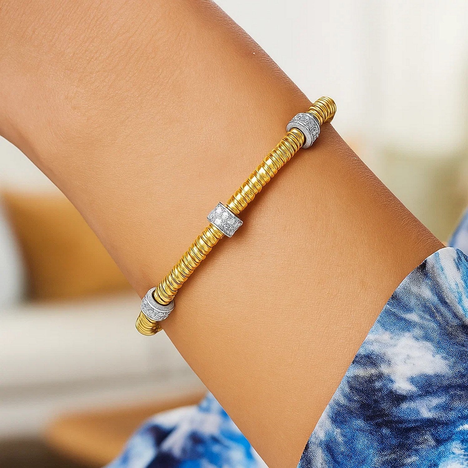 14K yellow gold diamond triple station tubogas bracelet showcasing modern luxury and exquisite craftsmanship.