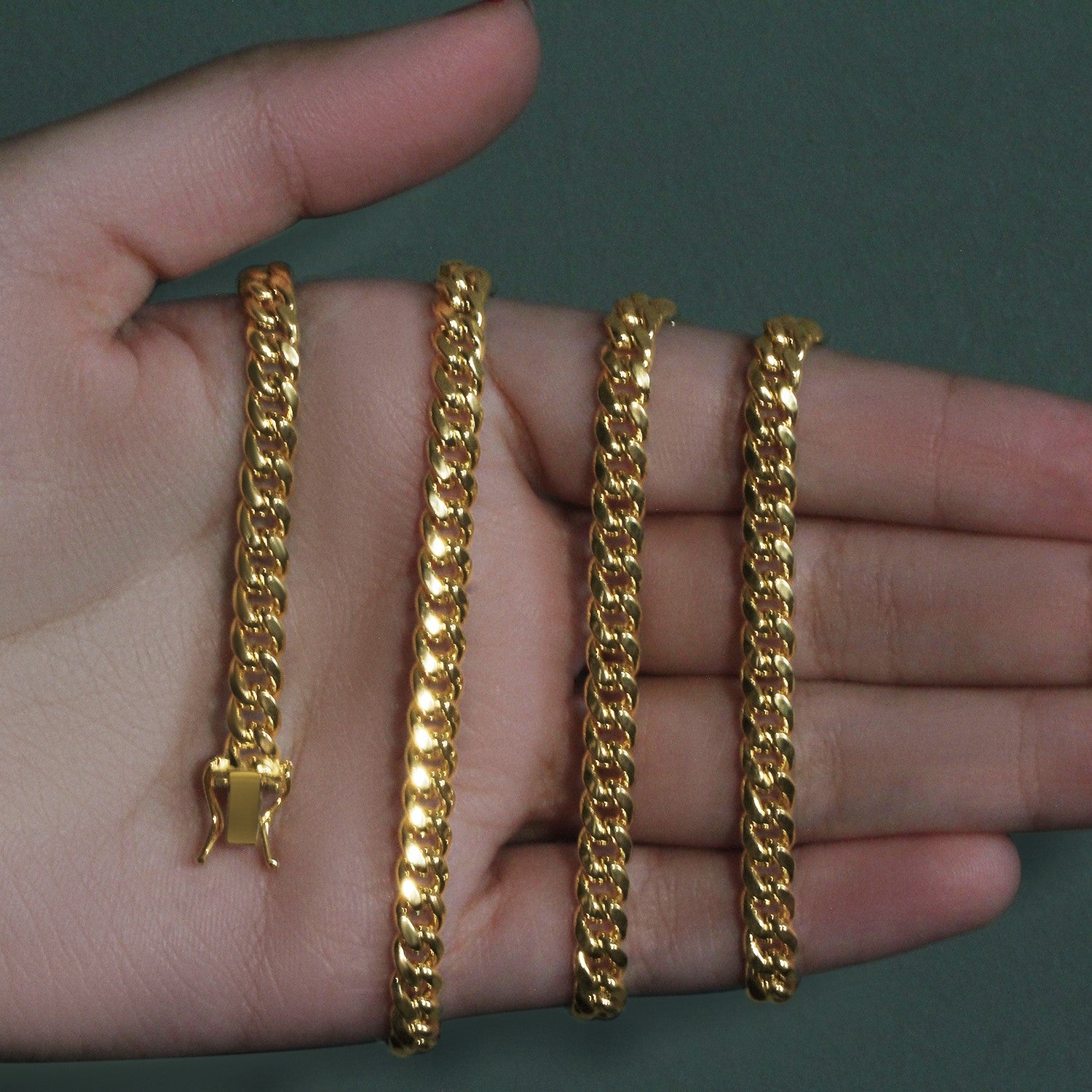 14k yellow gold semi-solid Miami Cuban chain, 5.00 mm, featuring an elegant round design for a luxurious look.