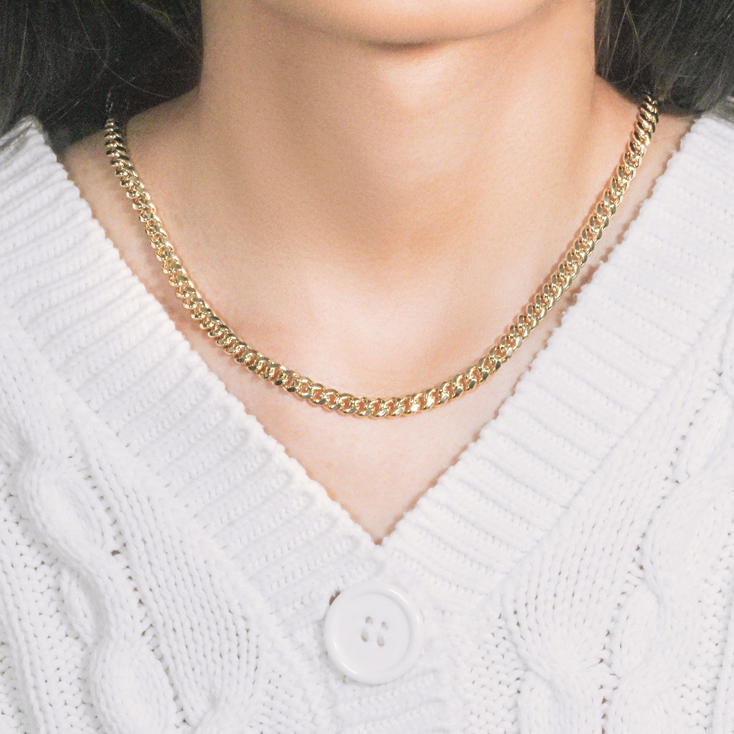 14k yellow gold semi-solid Miami Cuban chain, 5.00 mm, showcasing elegant round links for a luxurious finish.