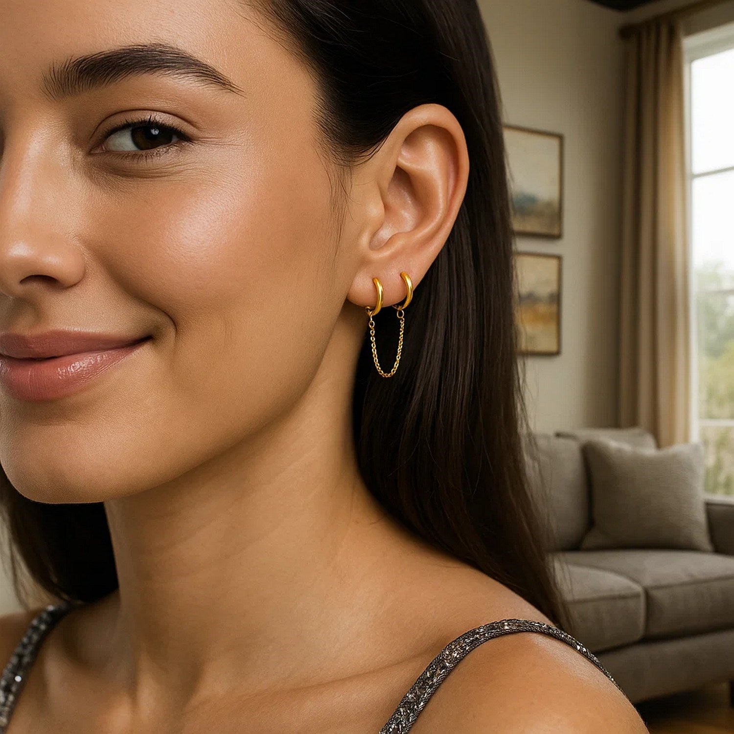 14k yellow gold huggie hoop earrings with a sleek modern design, perfect for elegant everyday wear.