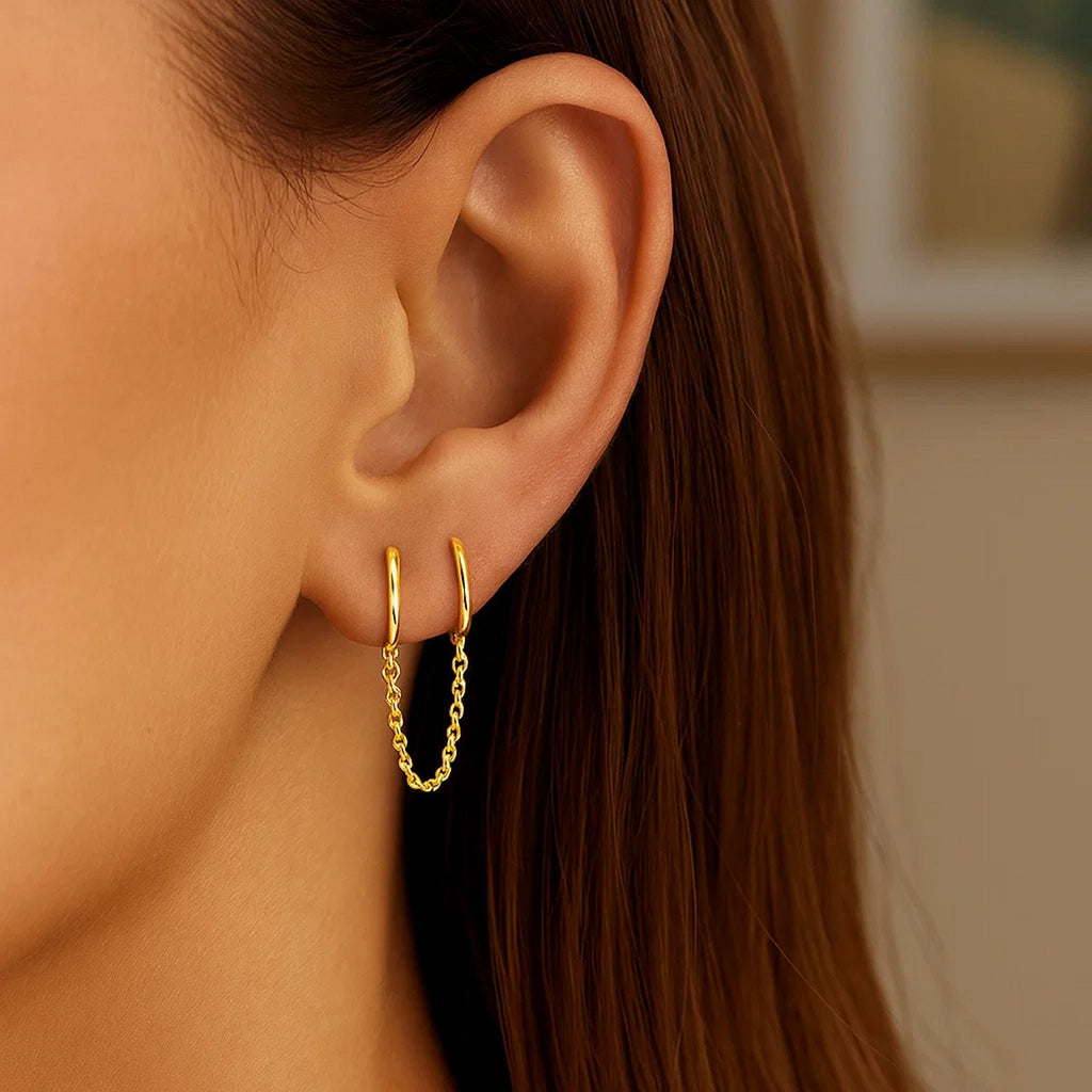 14k yellow gold modern huggie hoop earrings featuring a sleek, minimalist design for effortless elegance.