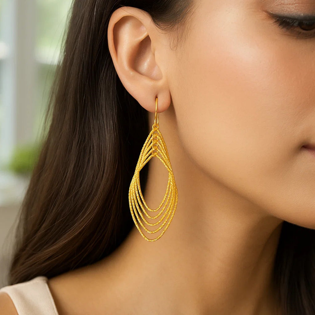 14k yellow gold textured marquise shape earrings, modern luxury design with elegant finish for sophisticated style.