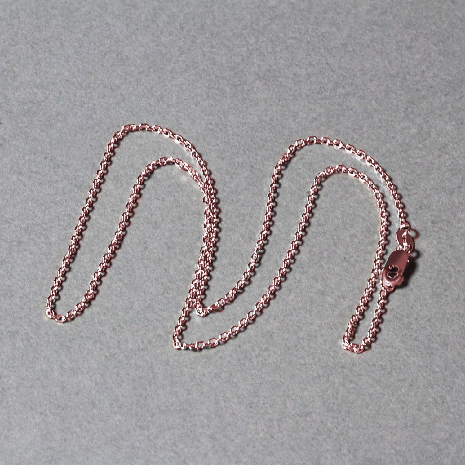 14k rose gold diamond cut cable link chain with modern design, showcasing elegant interlocking links.