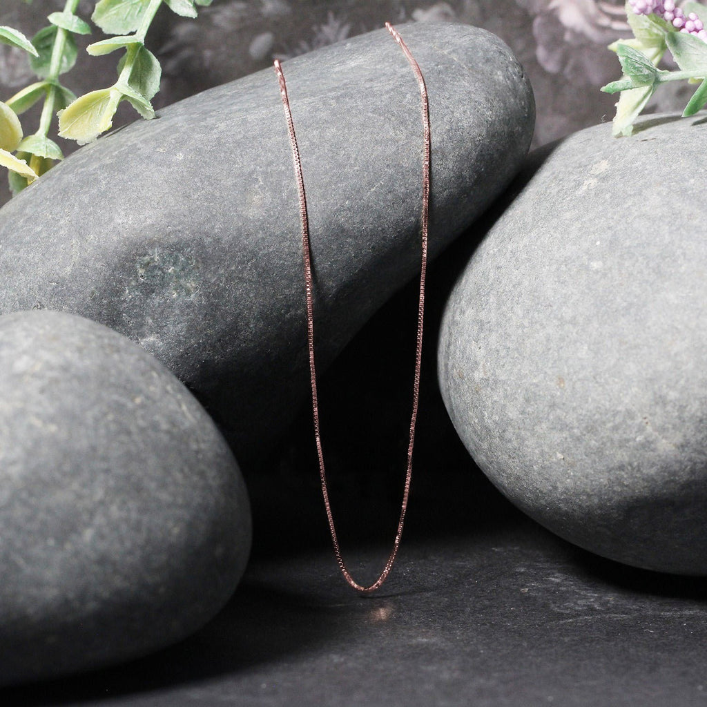 18k rose gold classic box chain featuring sleek links, perfect for layering or wearing solo as a timeless statement piece.