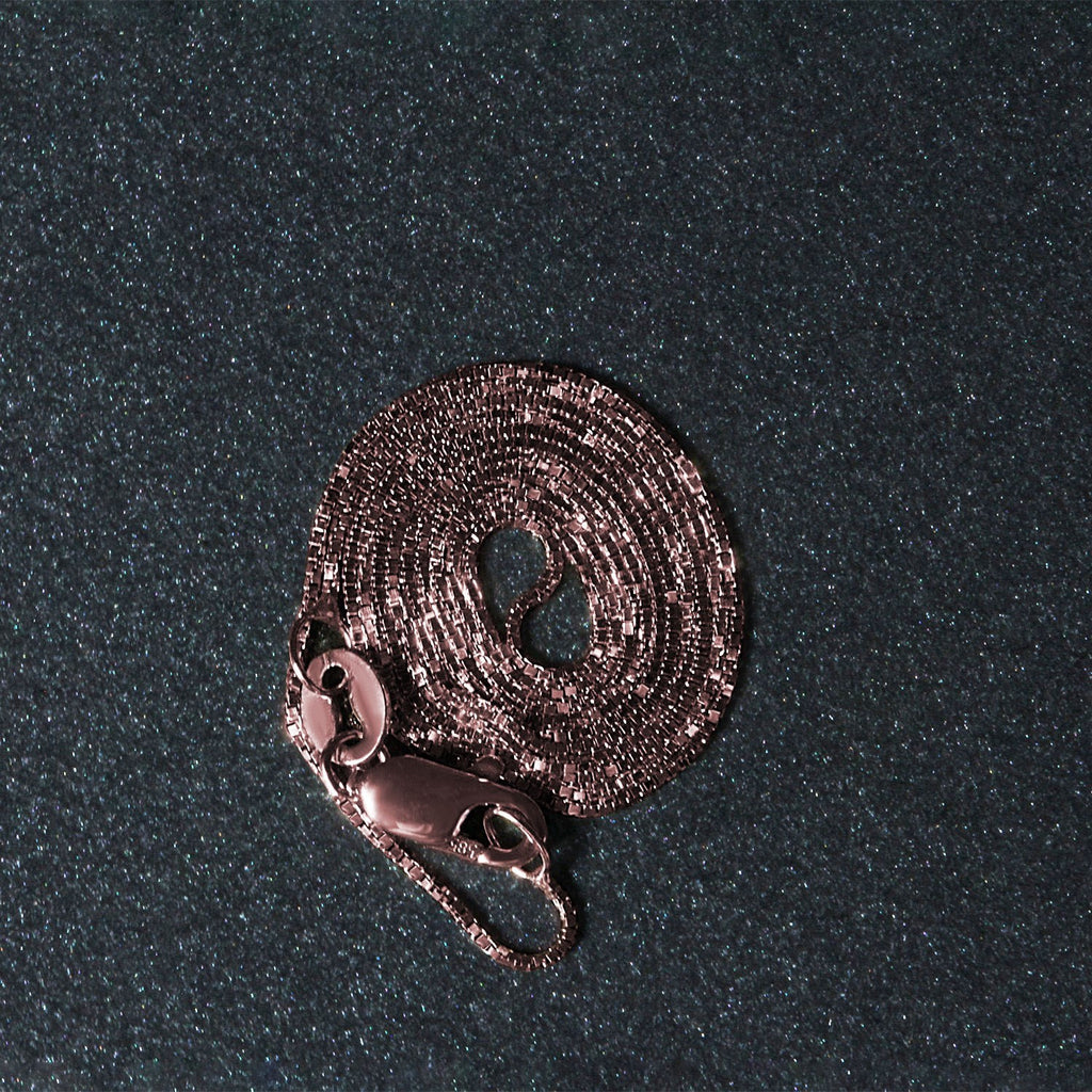 18k rose gold classic box chain with elegant links, perfect for layering or wearing solo as a timeless statement piece.