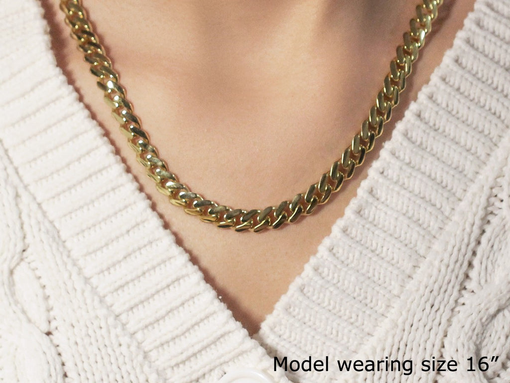 14k yellow gold polished Miami Cuban chain necklace with modern design and luxurious shine, perfect for any occasion.