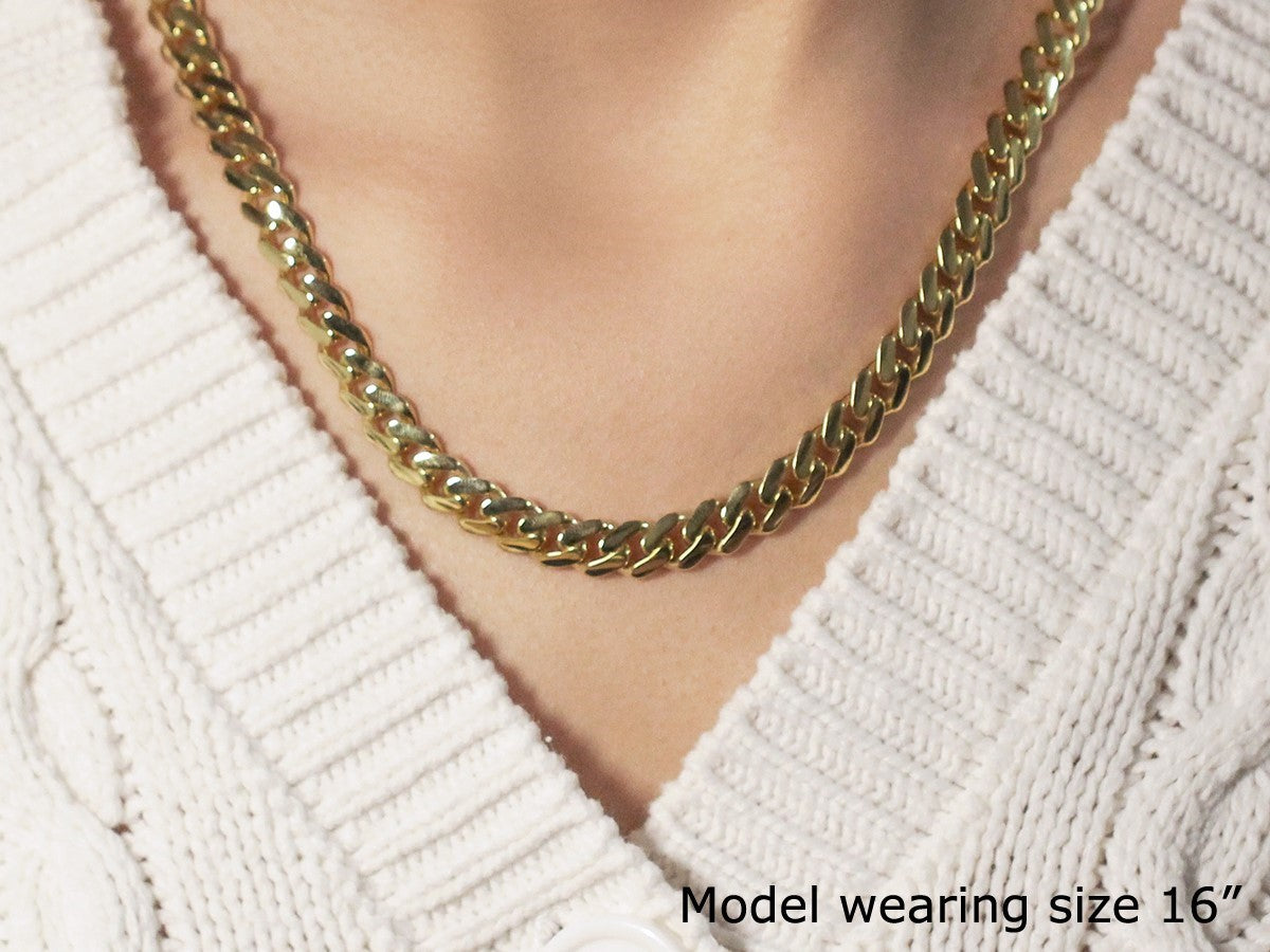 14k yellow gold polished Miami Cuban chain necklace with modern design and luxurious shine, perfect for any occasion.