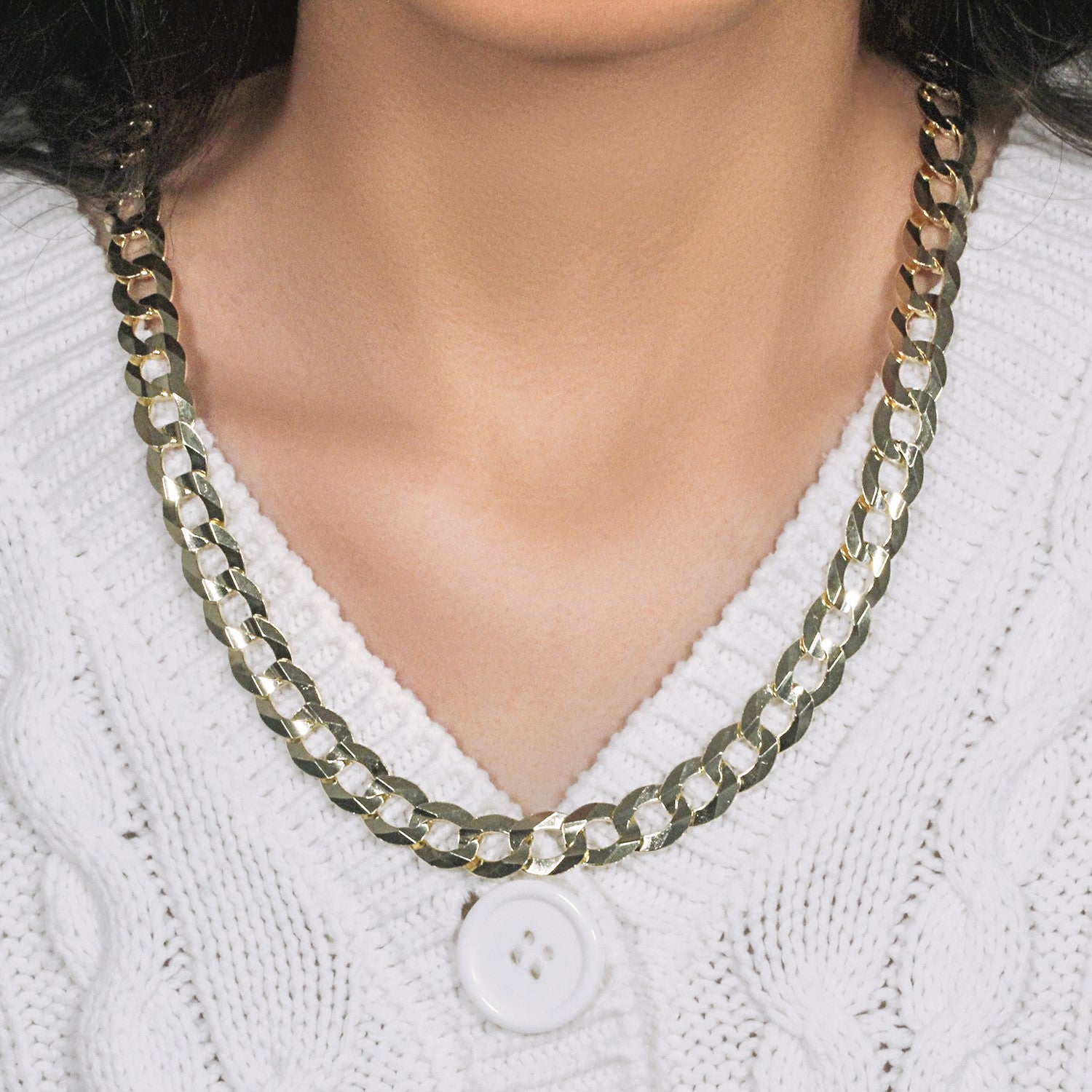 Solid curb chain in modern design, crafted from 14k yellow gold, featuring elegant interlocking links.