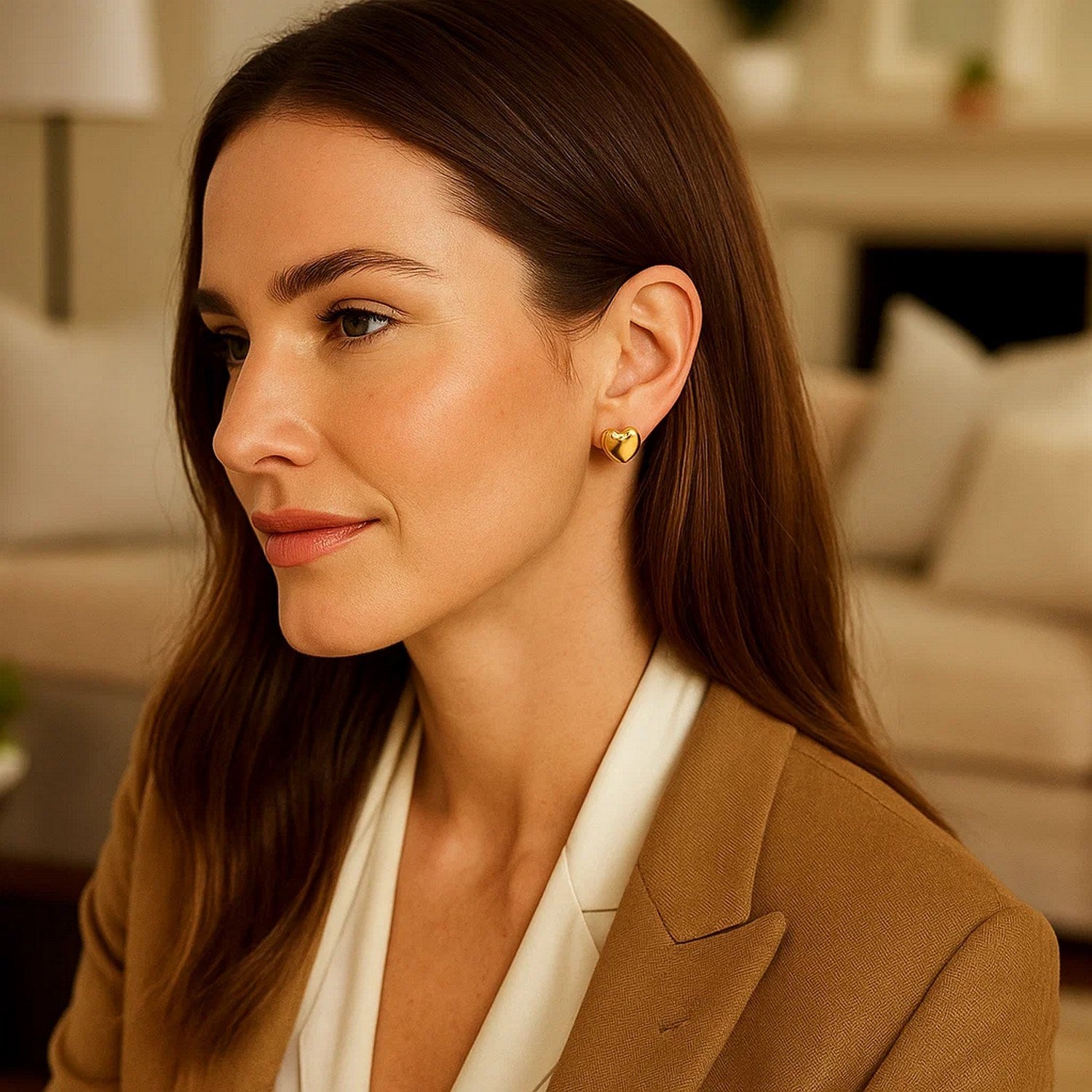Elegant 14k yellow gold puffed heart stud earrings showcasing a polished finish for a luxurious touch.