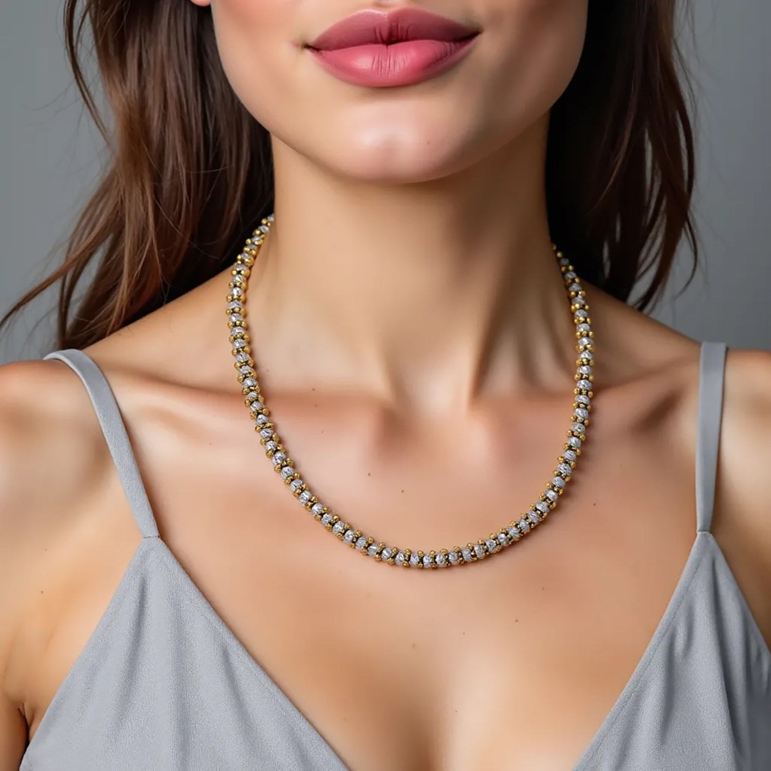 Elegant two-tone pallina bead necklace in 14k gold and sterling silver, featuring a lustrous pearl on a delicate chain.
