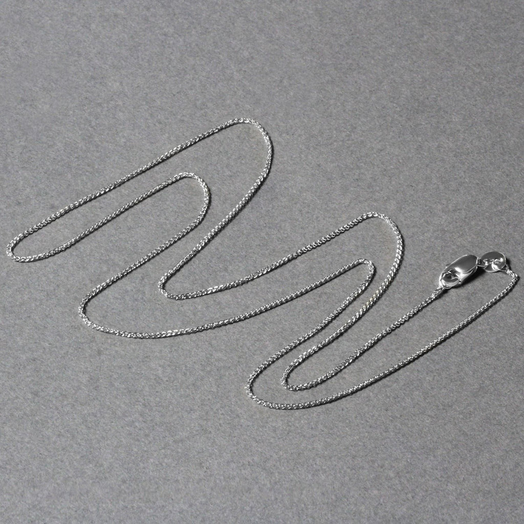 Elegant 14k white gold round wheat chain, 0.80 mm, showcasing a refined, timeless design for luxury jewelry lovers.