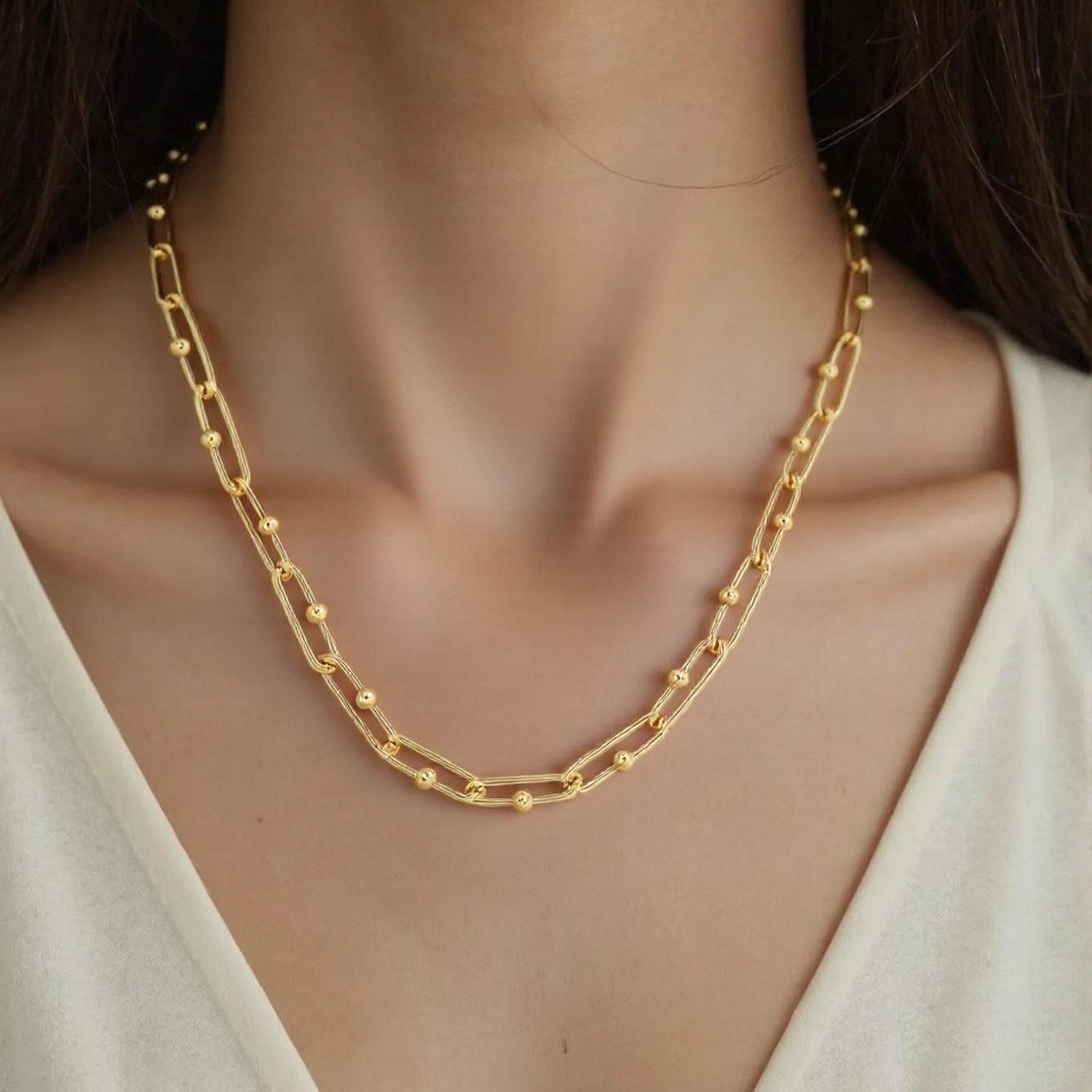 14k yellow gold high polish elongated paperclip Jax link necklace, showcasing modern elegance and refined craftsmanship.