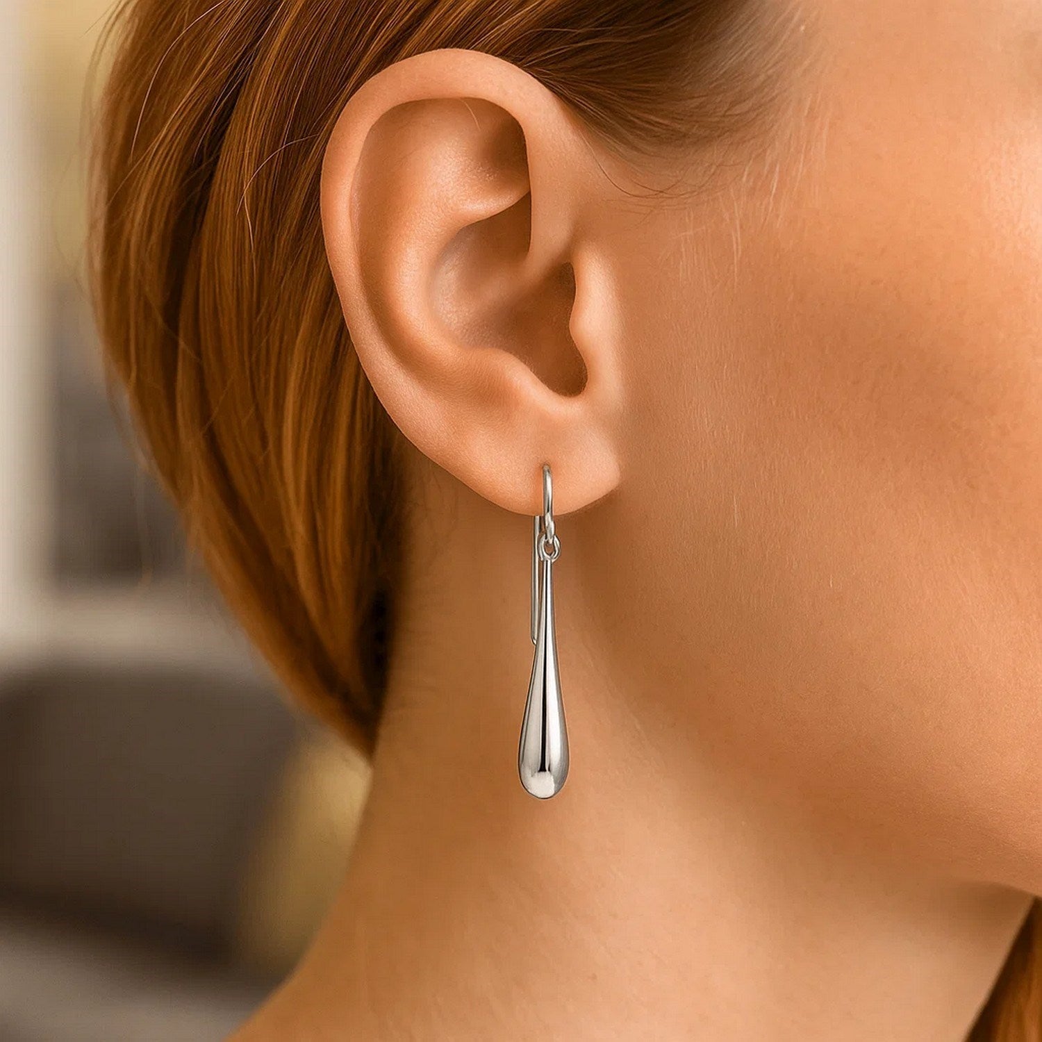 14k white gold polished teardrop dangle earrings exuding elegance with a refined, timeless design.